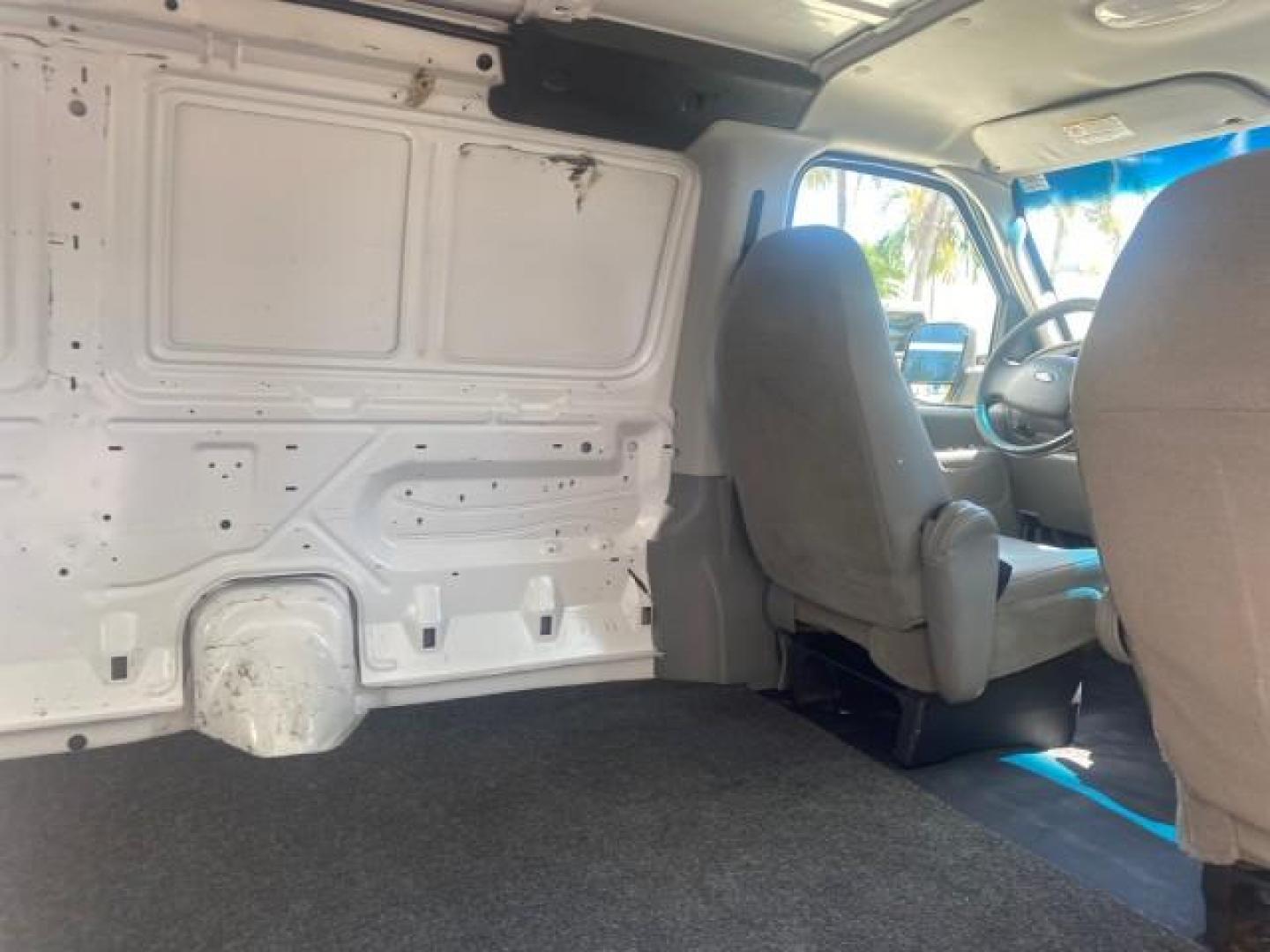 2006 Oxford White /Medium Flint Ford Econoline Cargo Van E350 LOW MILES 66,160 (1FTSE34L56D) with an 5.4L SOHC EFI V8 Triton Engine engine, Automatic transmission, located at 4701 North Dixie Hwy, Pompano Beach, FL, 33064, (954) 422-2889, 26.240938, -80.123474 - OUR WEBPAGE FLORIDACARS1.COM HAS OVER 100 PHOTOS AND FREE CARFAX LINK 2006 FORD E-SERIES E-350 SD CARGO VIN: 1FTSE34L56DB06011 1 F T S E 3 4 L 5 6 D B 0 6 0 1 1 VAN 5.4L V8 F GASOLINE REAR WHEEL DRIVE Top Features Vinyl Seats Basic Features ABS Brakes AM/FM Stereo Air Conditioning Automatic Transmis - Photo#94