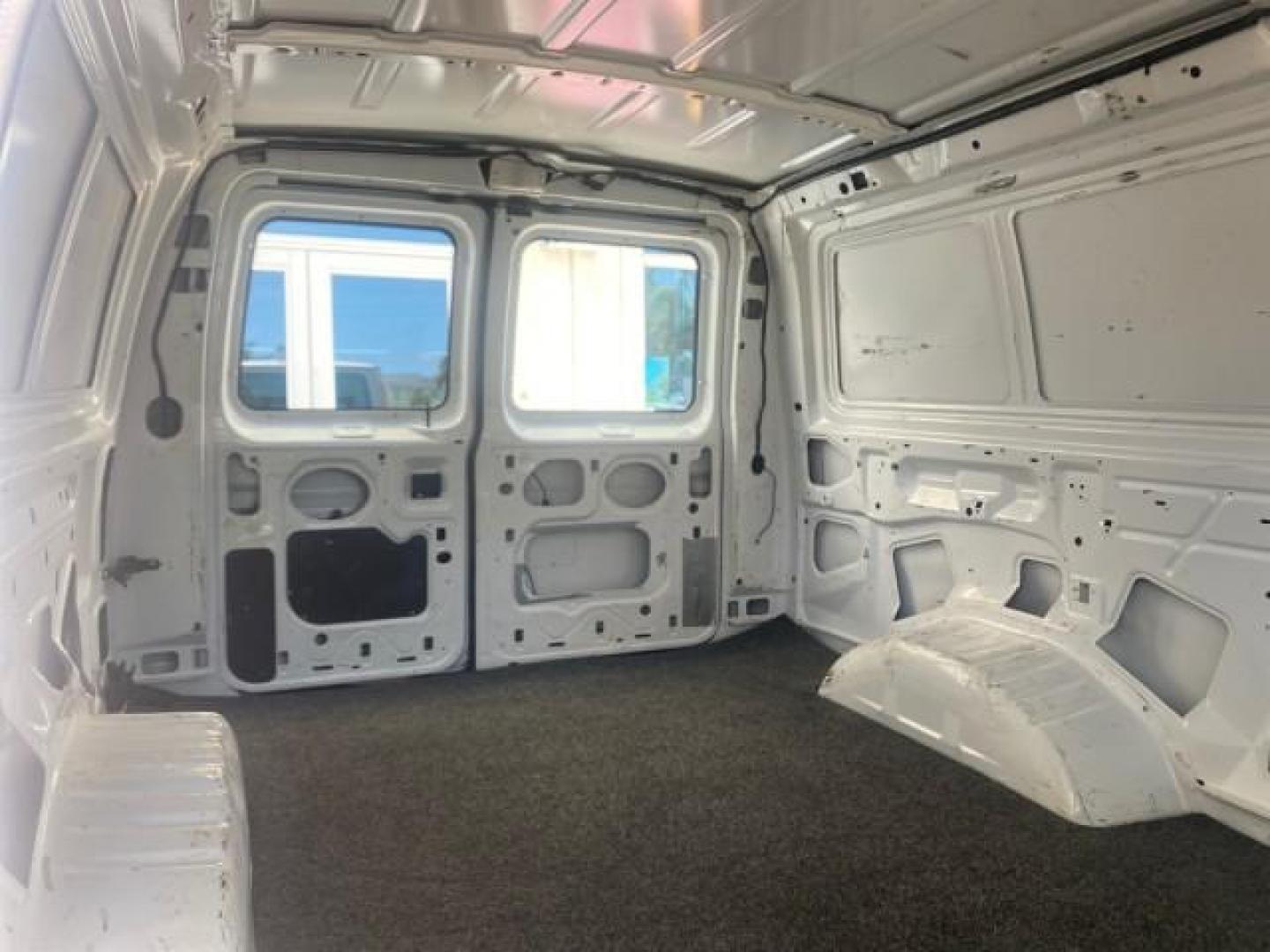 2006 Oxford White /Medium Flint Ford Econoline Cargo Van E350 LOW MILES 66,160 (1FTSE34L56D) with an 5.4L SOHC EFI V8 Triton Engine engine, Automatic transmission, located at 4701 North Dixie Hwy, Pompano Beach, FL, 33064, (954) 422-2889, 26.240938, -80.123474 - OUR WEBPAGE FLORIDACARS1.COM HAS OVER 100 PHOTOS AND FREE CARFAX LINK 2006 FORD E-SERIES E-350 SD CARGO VIN: 1FTSE34L56DB06011 1 F T S E 3 4 L 5 6 D B 0 6 0 1 1 VAN 5.4L V8 F GASOLINE REAR WHEEL DRIVE Top Features Vinyl Seats Basic Features ABS Brakes AM/FM Stereo Air Conditioning Automatic Transmis - Photo#97