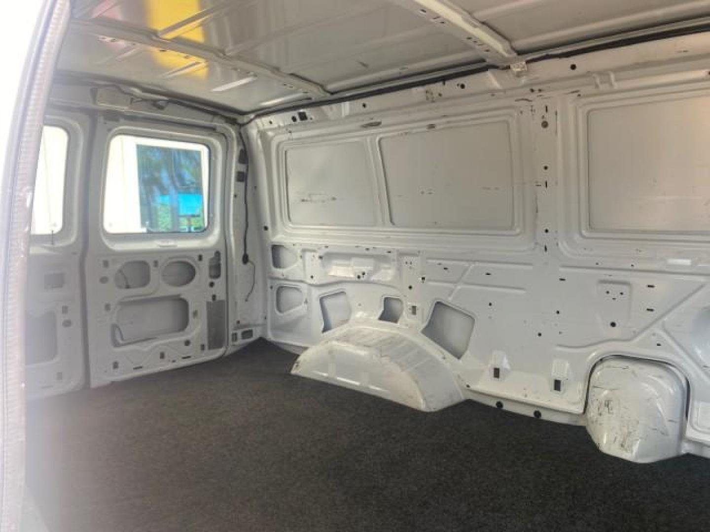 2006 Oxford White /Medium Flint Ford Econoline Cargo Van E350 LOW MILES 66,160 (1FTSE34L56D) with an 5.4L SOHC EFI V8 Triton Engine engine, Automatic transmission, located at 4701 North Dixie Hwy, Pompano Beach, FL, 33064, (954) 422-2889, 26.240938, -80.123474 - OUR WEBPAGE FLORIDACARS1.COM HAS OVER 100 PHOTOS AND FREE CARFAX LINK 2006 FORD E-SERIES E-350 SD CARGO VIN: 1FTSE34L56DB06011 1 F T S E 3 4 L 5 6 D B 0 6 0 1 1 VAN 5.4L V8 F GASOLINE REAR WHEEL DRIVE Top Features Vinyl Seats Basic Features ABS Brakes AM/FM Stereo Air Conditioning Automatic Transmis - Photo#99