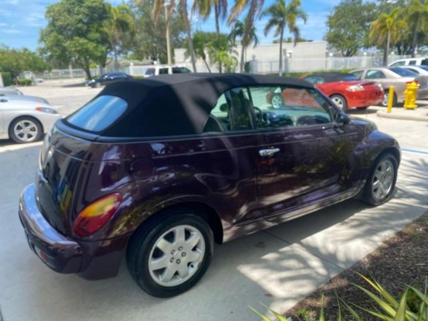 2005 Dark Plum Pearl /Taupe/Pearl Beige Chrysler PT Cruiser TURBO CONV LOW MILES 28,028 (3C3AY55E65T) with an 2.4L DOHC 16-Valve Turbo I4 Engine engine, Automatic transmission, located at 4701 North Dixie Hwy, Pompano Beach, FL, 33064, (954) 422-2889, 26.240938, -80.123474 - OUR WEBPAGE FLORIDACARS1.COM HAS OVER 100 PHOTOS AND FREE CARFAX LINK 2005 CHRYSLER PT CRUISER TOURING LEATHER LOADED VERY NICE NONSMOKER VIN: 3C3AY55E65T518675 3 C 3 A Y 5 5 E 6 5 T 5 1 8 6 7 5 CONVERTIBLE 2.4L I4 F DOHC 16V GASOLINE FRONT WHEEL DRIVE Top Features Alloy Wheels Leather Seats Satelli - Photo#7