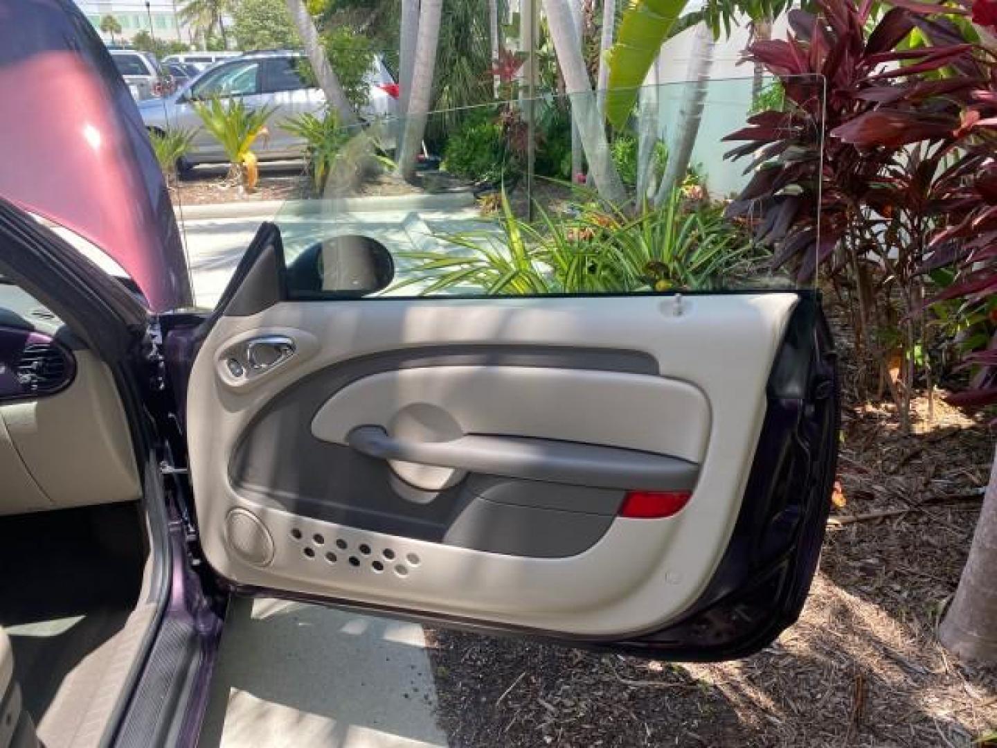 2005 Dark Plum Pearl /Taupe/Pearl Beige Chrysler PT Cruiser TURBO CONV LOW MILES 28,028 (3C3AY55E65T) with an 2.4L DOHC 16-Valve Turbo I4 Engine engine, Automatic transmission, located at 4701 North Dixie Hwy, Pompano Beach, FL, 33064, (954) 422-2889, 26.240938, -80.123474 - OUR WEBPAGE FLORIDACARS1.COM HAS OVER 100 PHOTOS AND FREE CARFAX LINK 2005 CHRYSLER PT CRUISER TOURING LEATHER LOADED VERY NICE NONSMOKER VIN: 3C3AY55E65T518675 3 C 3 A Y 5 5 E 6 5 T 5 1 8 6 7 5 CONVERTIBLE 2.4L I4 F DOHC 16V GASOLINE FRONT WHEEL DRIVE Top Features Alloy Wheels Leather Seats Satelli - Photo#11