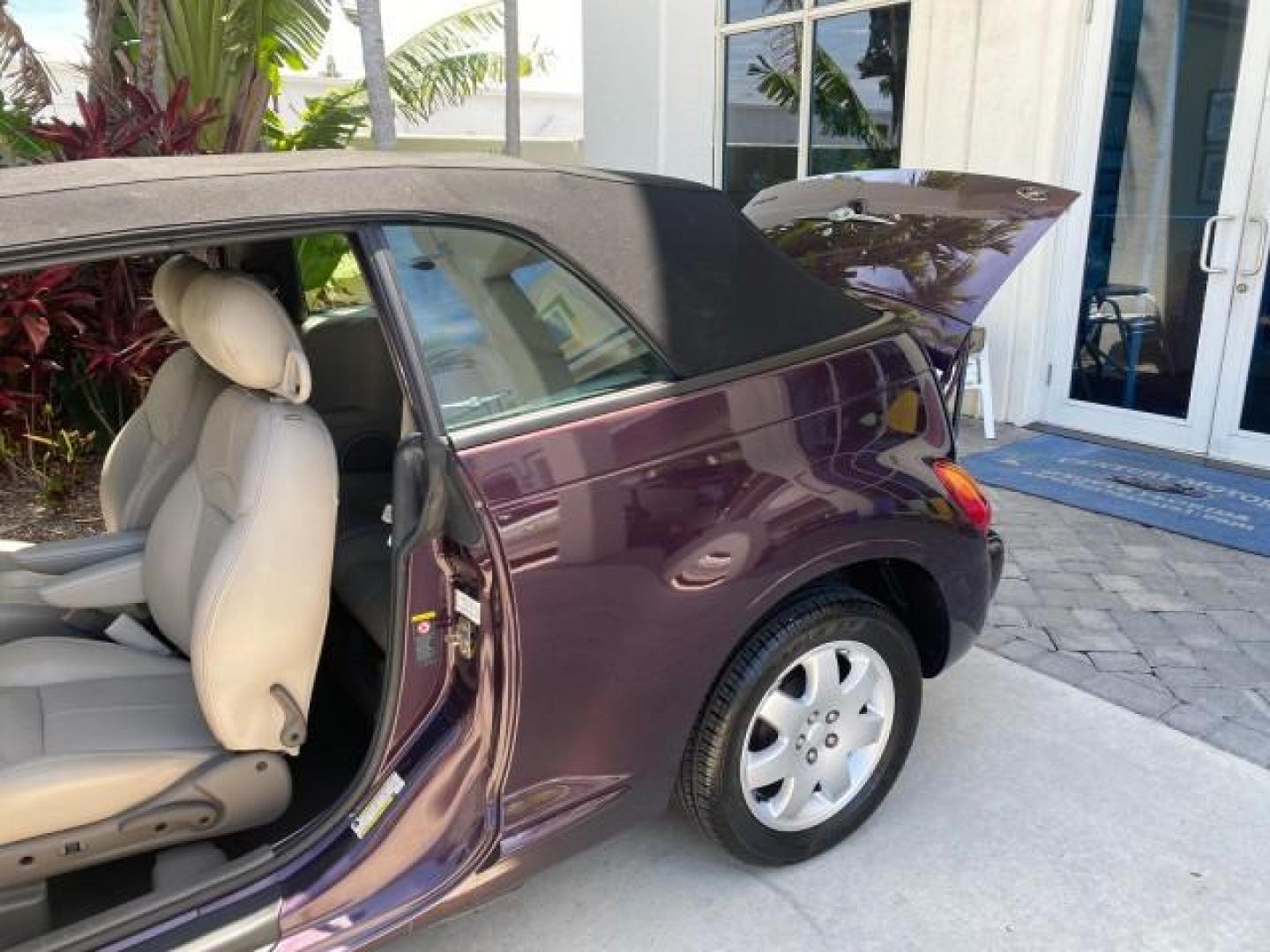 2005 Dark Plum Pearl /Taupe/Pearl Beige Chrysler PT Cruiser TURBO CONV LOW MILES 28,028 (3C3AY55E65T) with an 2.4L DOHC 16-Valve Turbo I4 Engine engine, Automatic transmission, located at 4701 North Dixie Hwy, Pompano Beach, FL, 33064, (954) 422-2889, 26.240938, -80.123474 - OUR WEBPAGE FLORIDACARS1.COM HAS OVER 100 PHOTOS AND FREE CARFAX LINK 2005 CHRYSLER PT CRUISER TOURING LEATHER LOADED VERY NICE NONSMOKER VIN: 3C3AY55E65T518675 3 C 3 A Y 5 5 E 6 5 T 5 1 8 6 7 5 CONVERTIBLE 2.4L I4 F DOHC 16V GASOLINE FRONT WHEEL DRIVE Top Features Alloy Wheels Leather Seats Satelli - Photo#13
