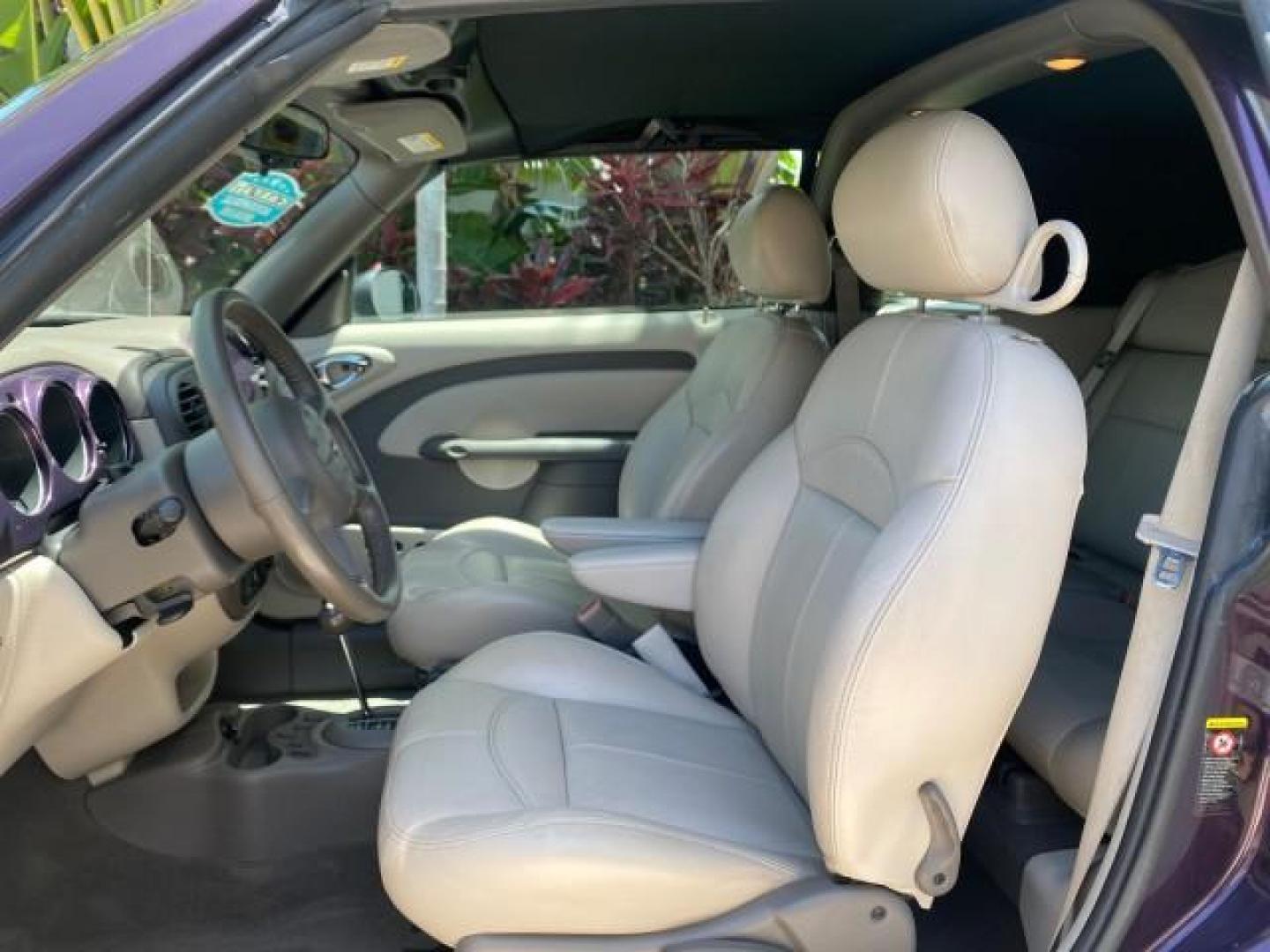 2005 Dark Plum Pearl /Taupe/Pearl Beige Chrysler PT Cruiser TURBO CONV LOW MILES 28,028 (3C3AY55E65T) with an 2.4L DOHC 16-Valve Turbo I4 Engine engine, Automatic transmission, located at 4701 North Dixie Hwy, Pompano Beach, FL, 33064, (954) 422-2889, 26.240938, -80.123474 - OUR WEBPAGE FLORIDACARS1.COM HAS OVER 100 PHOTOS AND FREE CARFAX LINK 2005 CHRYSLER PT CRUISER TOURING LEATHER LOADED VERY NICE NONSMOKER VIN: 3C3AY55E65T518675 3 C 3 A Y 5 5 E 6 5 T 5 1 8 6 7 5 CONVERTIBLE 2.4L I4 F DOHC 16V GASOLINE FRONT WHEEL DRIVE Top Features Alloy Wheels Leather Seats Satelli - Photo#33