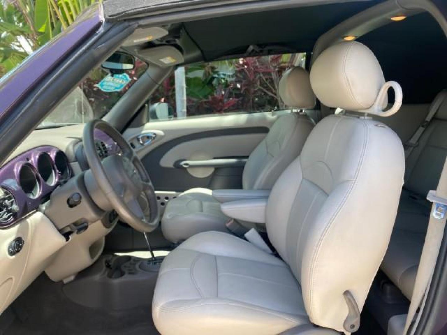 2005 Dark Plum Pearl /Taupe/Pearl Beige Chrysler PT Cruiser TURBO CONV LOW MILES 28,028 (3C3AY55E65T) with an 2.4L DOHC 16-Valve Turbo I4 Engine engine, Automatic transmission, located at 4701 North Dixie Hwy, Pompano Beach, FL, 33064, (954) 422-2889, 26.240938, -80.123474 - OUR WEBPAGE FLORIDACARS1.COM HAS OVER 100 PHOTOS AND FREE CARFAX LINK 2005 CHRYSLER PT CRUISER TOURING LEATHER LOADED VERY NICE NONSMOKER VIN: 3C3AY55E65T518675 3 C 3 A Y 5 5 E 6 5 T 5 1 8 6 7 5 CONVERTIBLE 2.4L I4 F DOHC 16V GASOLINE FRONT WHEEL DRIVE Top Features Alloy Wheels Leather Seats Satelli - Photo#34