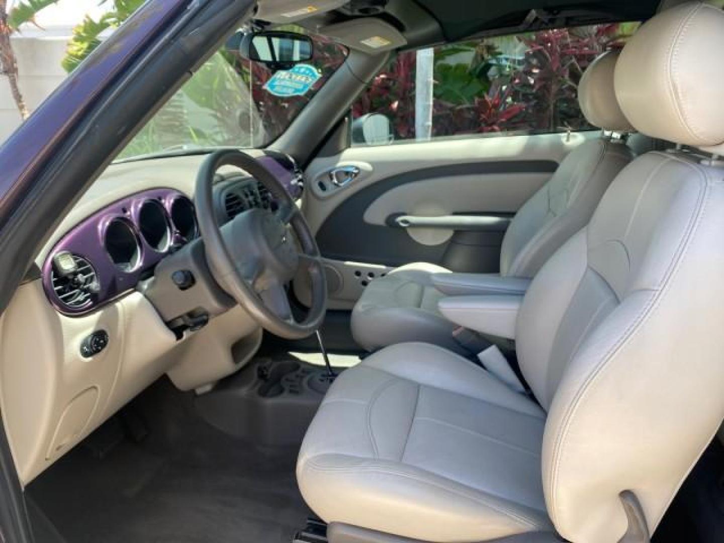 2005 Dark Plum Pearl /Taupe/Pearl Beige Chrysler PT Cruiser TURBO CONV LOW MILES 28,028 (3C3AY55E65T) with an 2.4L DOHC 16-Valve Turbo I4 Engine engine, Automatic transmission, located at 4701 North Dixie Hwy, Pompano Beach, FL, 33064, (954) 422-2889, 26.240938, -80.123474 - OUR WEBPAGE FLORIDACARS1.COM HAS OVER 100 PHOTOS AND FREE CARFAX LINK 2005 CHRYSLER PT CRUISER TOURING LEATHER LOADED VERY NICE NONSMOKER VIN: 3C3AY55E65T518675 3 C 3 A Y 5 5 E 6 5 T 5 1 8 6 7 5 CONVERTIBLE 2.4L I4 F DOHC 16V GASOLINE FRONT WHEEL DRIVE Top Features Alloy Wheels Leather Seats Satelli - Photo#36