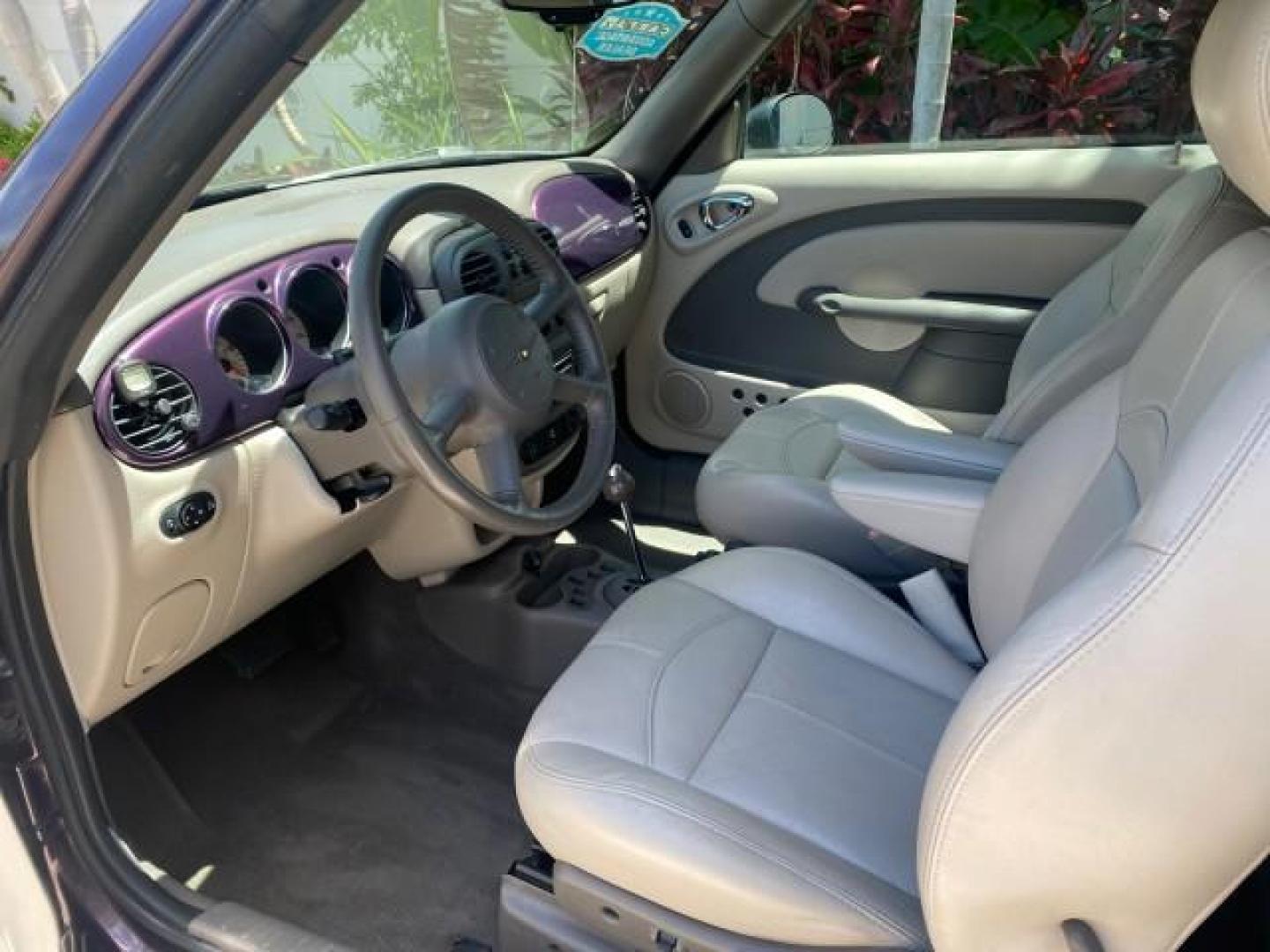 2005 Dark Plum Pearl /Taupe/Pearl Beige Chrysler PT Cruiser TURBO CONV LOW MILES 28,028 (3C3AY55E65T) with an 2.4L DOHC 16-Valve Turbo I4 Engine engine, Automatic transmission, located at 4701 North Dixie Hwy, Pompano Beach, FL, 33064, (954) 422-2889, 26.240938, -80.123474 - OUR WEBPAGE FLORIDACARS1.COM HAS OVER 100 PHOTOS AND FREE CARFAX LINK 2005 CHRYSLER PT CRUISER TOURING LEATHER LOADED VERY NICE NONSMOKER VIN: 3C3AY55E65T518675 3 C 3 A Y 5 5 E 6 5 T 5 1 8 6 7 5 CONVERTIBLE 2.4L I4 F DOHC 16V GASOLINE FRONT WHEEL DRIVE Top Features Alloy Wheels Leather Seats Satelli - Photo#37