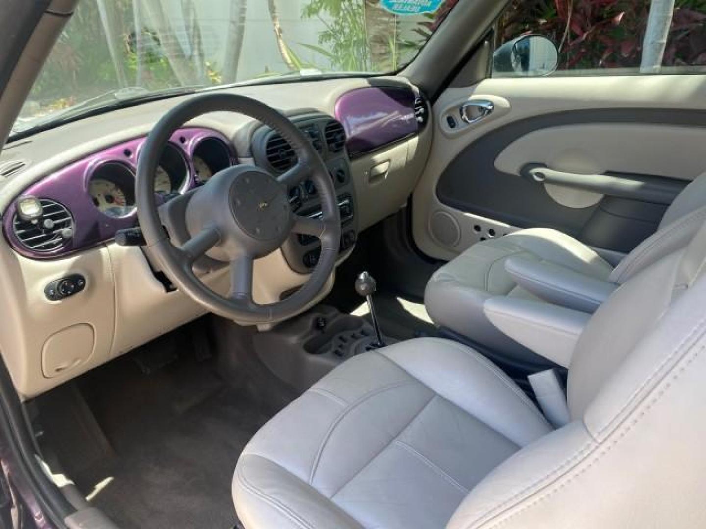 2005 Dark Plum Pearl /Taupe/Pearl Beige Chrysler PT Cruiser TURBO CONV LOW MILES 28,028 (3C3AY55E65T) with an 2.4L DOHC 16-Valve Turbo I4 Engine engine, Automatic transmission, located at 4701 North Dixie Hwy, Pompano Beach, FL, 33064, (954) 422-2889, 26.240938, -80.123474 - OUR WEBPAGE FLORIDACARS1.COM HAS OVER 100 PHOTOS AND FREE CARFAX LINK 2005 CHRYSLER PT CRUISER TOURING LEATHER LOADED VERY NICE NONSMOKER VIN: 3C3AY55E65T518675 3 C 3 A Y 5 5 E 6 5 T 5 1 8 6 7 5 CONVERTIBLE 2.4L I4 F DOHC 16V GASOLINE FRONT WHEEL DRIVE Top Features Alloy Wheels Leather Seats Satelli - Photo#38