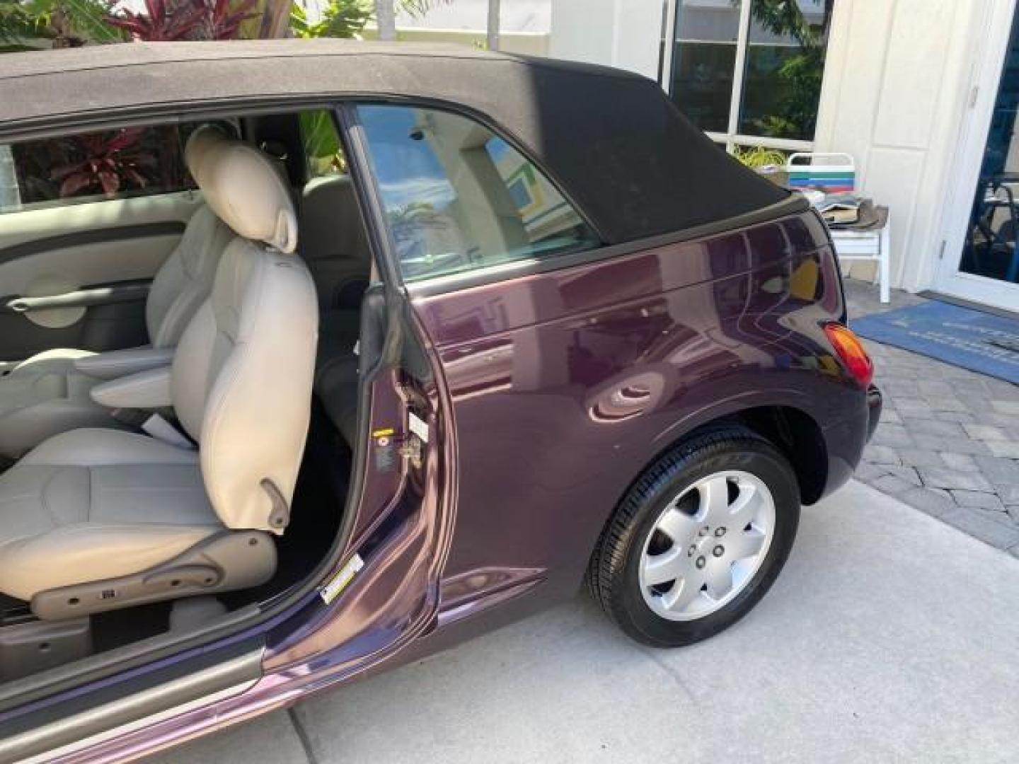 2005 Dark Plum Pearl /Taupe/Pearl Beige Chrysler PT Cruiser TURBO CONV LOW MILES 28,028 (3C3AY55E65T) with an 2.4L DOHC 16-Valve Turbo I4 Engine engine, Automatic transmission, located at 4701 North Dixie Hwy, Pompano Beach, FL, 33064, (954) 422-2889, 26.240938, -80.123474 - OUR WEBPAGE FLORIDACARS1.COM HAS OVER 100 PHOTOS AND FREE CARFAX LINK 2005 CHRYSLER PT CRUISER TOURING LEATHER LOADED VERY NICE NONSMOKER VIN: 3C3AY55E65T518675 3 C 3 A Y 5 5 E 6 5 T 5 1 8 6 7 5 CONVERTIBLE 2.4L I4 F DOHC 16V GASOLINE FRONT WHEEL DRIVE Top Features Alloy Wheels Leather Seats Satelli - Photo#58