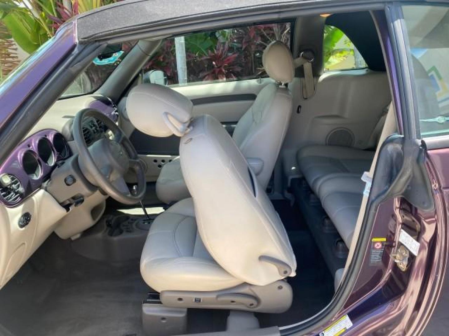 2005 Dark Plum Pearl /Taupe/Pearl Beige Chrysler PT Cruiser TURBO CONV LOW MILES 28,028 (3C3AY55E65T) with an 2.4L DOHC 16-Valve Turbo I4 Engine engine, Automatic transmission, located at 4701 North Dixie Hwy, Pompano Beach, FL, 33064, (954) 422-2889, 26.240938, -80.123474 - OUR WEBPAGE FLORIDACARS1.COM HAS OVER 100 PHOTOS AND FREE CARFAX LINK 2005 CHRYSLER PT CRUISER TOURING LEATHER LOADED VERY NICE NONSMOKER VIN: 3C3AY55E65T518675 3 C 3 A Y 5 5 E 6 5 T 5 1 8 6 7 5 CONVERTIBLE 2.4L I4 F DOHC 16V GASOLINE FRONT WHEEL DRIVE Top Features Alloy Wheels Leather Seats Satelli - Photo#59