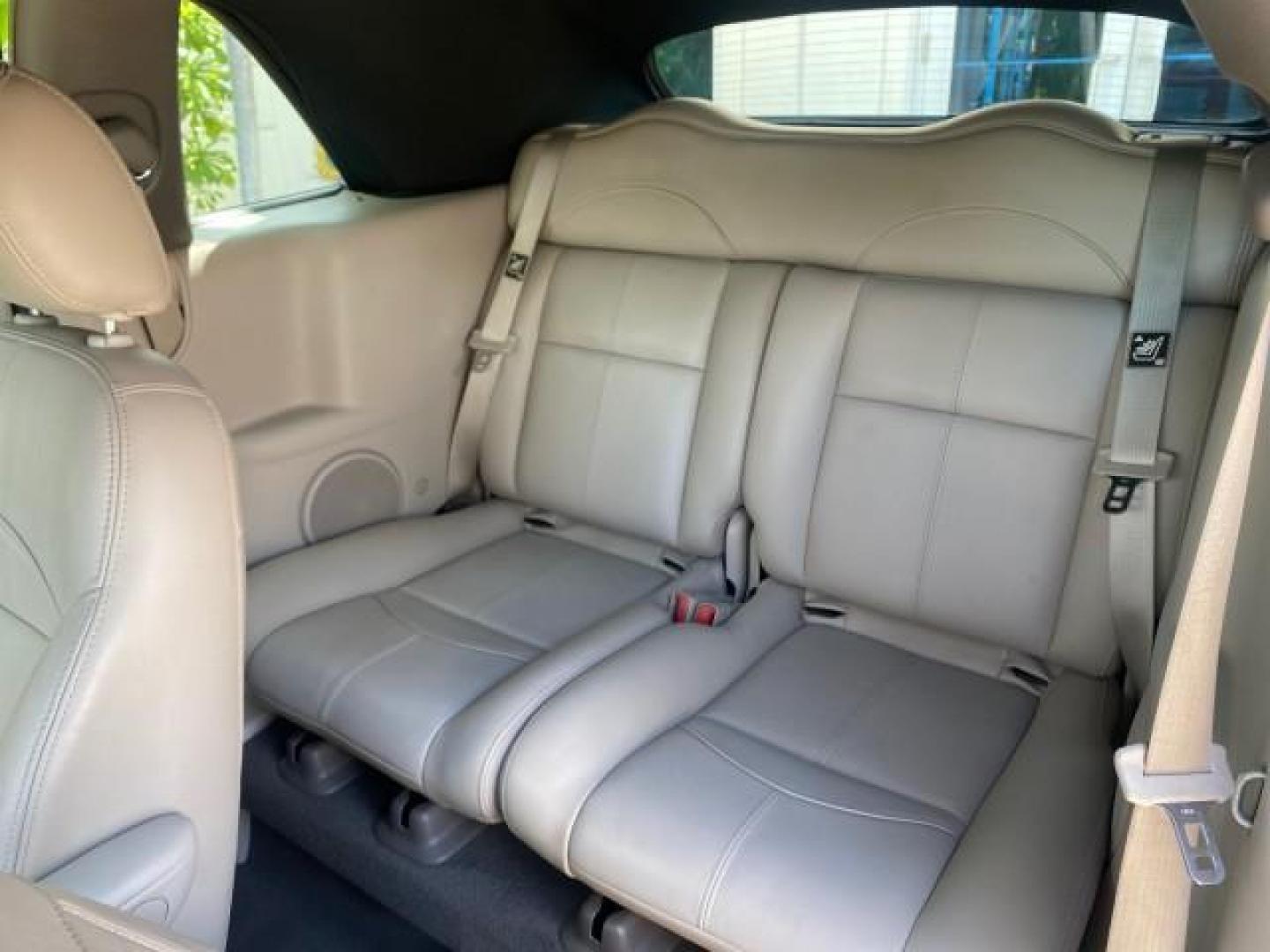 2005 Dark Plum Pearl /Taupe/Pearl Beige Chrysler PT Cruiser TURBO CONV LOW MILES 28,028 (3C3AY55E65T) with an 2.4L DOHC 16-Valve Turbo I4 Engine engine, Automatic transmission, located at 4701 North Dixie Hwy, Pompano Beach, FL, 33064, (954) 422-2889, 26.240938, -80.123474 - OUR WEBPAGE FLORIDACARS1.COM HAS OVER 100 PHOTOS AND FREE CARFAX LINK 2005 CHRYSLER PT CRUISER TOURING LEATHER LOADED VERY NICE NONSMOKER VIN: 3C3AY55E65T518675 3 C 3 A Y 5 5 E 6 5 T 5 1 8 6 7 5 CONVERTIBLE 2.4L I4 F DOHC 16V GASOLINE FRONT WHEEL DRIVE Top Features Alloy Wheels Leather Seats Satelli - Photo#61
