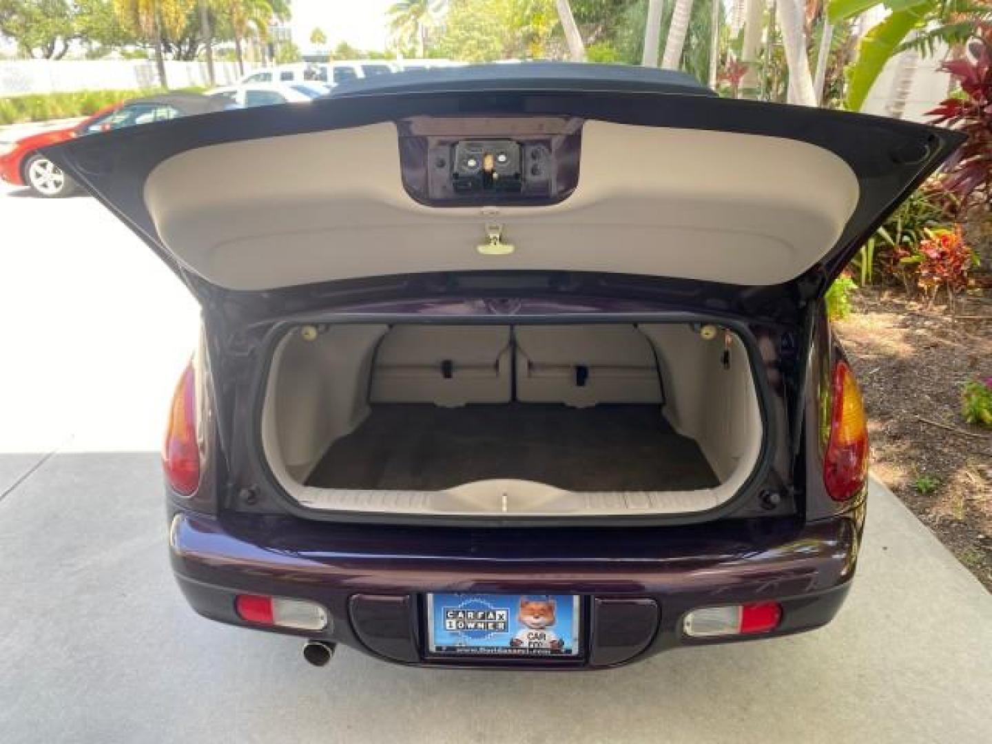 2005 Dark Plum Pearl /Taupe/Pearl Beige Chrysler PT Cruiser TURBO CONV LOW MILES 28,028 (3C3AY55E65T) with an 2.4L DOHC 16-Valve Turbo I4 Engine engine, Automatic transmission, located at 4701 North Dixie Hwy, Pompano Beach, FL, 33064, (954) 422-2889, 26.240938, -80.123474 - OUR WEBPAGE FLORIDACARS1.COM HAS OVER 100 PHOTOS AND FREE CARFAX LINK 2005 CHRYSLER PT CRUISER TOURING LEATHER LOADED VERY NICE NONSMOKER VIN: 3C3AY55E65T518675 3 C 3 A Y 5 5 E 6 5 T 5 1 8 6 7 5 CONVERTIBLE 2.4L I4 F DOHC 16V GASOLINE FRONT WHEEL DRIVE Top Features Alloy Wheels Leather Seats Satelli - Photo#72