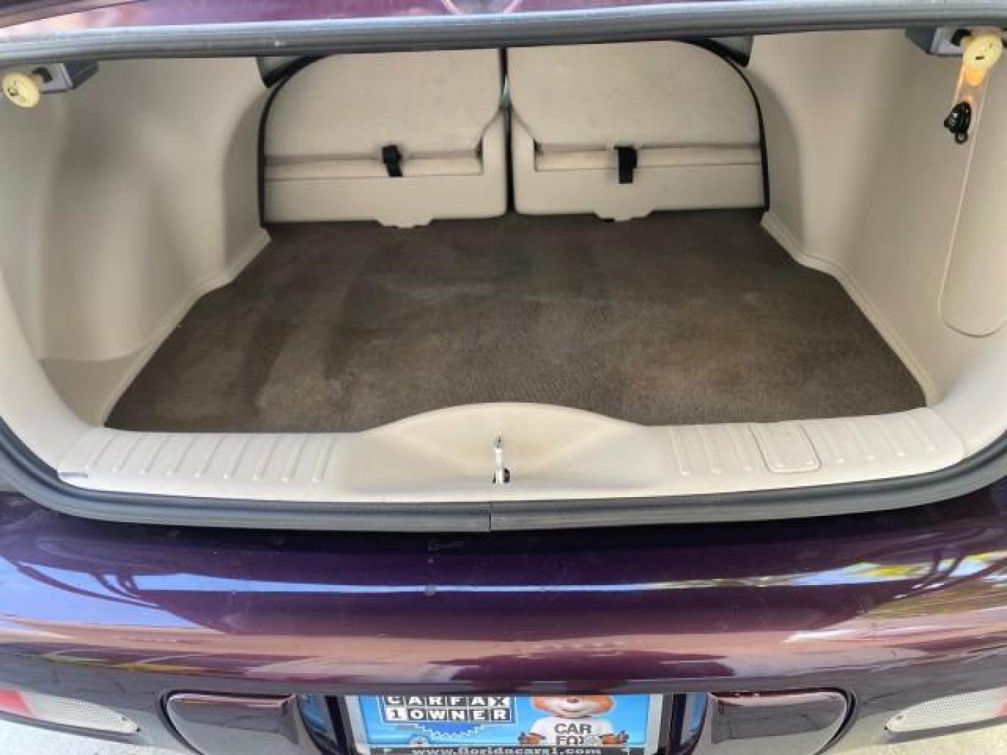 2005 Dark Plum Pearl /Taupe/Pearl Beige Chrysler PT Cruiser TURBO CONV LOW MILES 28,028 (3C3AY55E65T) with an 2.4L DOHC 16-Valve Turbo I4 Engine engine, Automatic transmission, located at 4701 North Dixie Hwy, Pompano Beach, FL, 33064, (954) 422-2889, 26.240938, -80.123474 - OUR WEBPAGE FLORIDACARS1.COM HAS OVER 100 PHOTOS AND FREE CARFAX LINK 2005 CHRYSLER PT CRUISER TOURING LEATHER LOADED VERY NICE NONSMOKER VIN: 3C3AY55E65T518675 3 C 3 A Y 5 5 E 6 5 T 5 1 8 6 7 5 CONVERTIBLE 2.4L I4 F DOHC 16V GASOLINE FRONT WHEEL DRIVE Top Features Alloy Wheels Leather Seats Satelli - Photo#73
