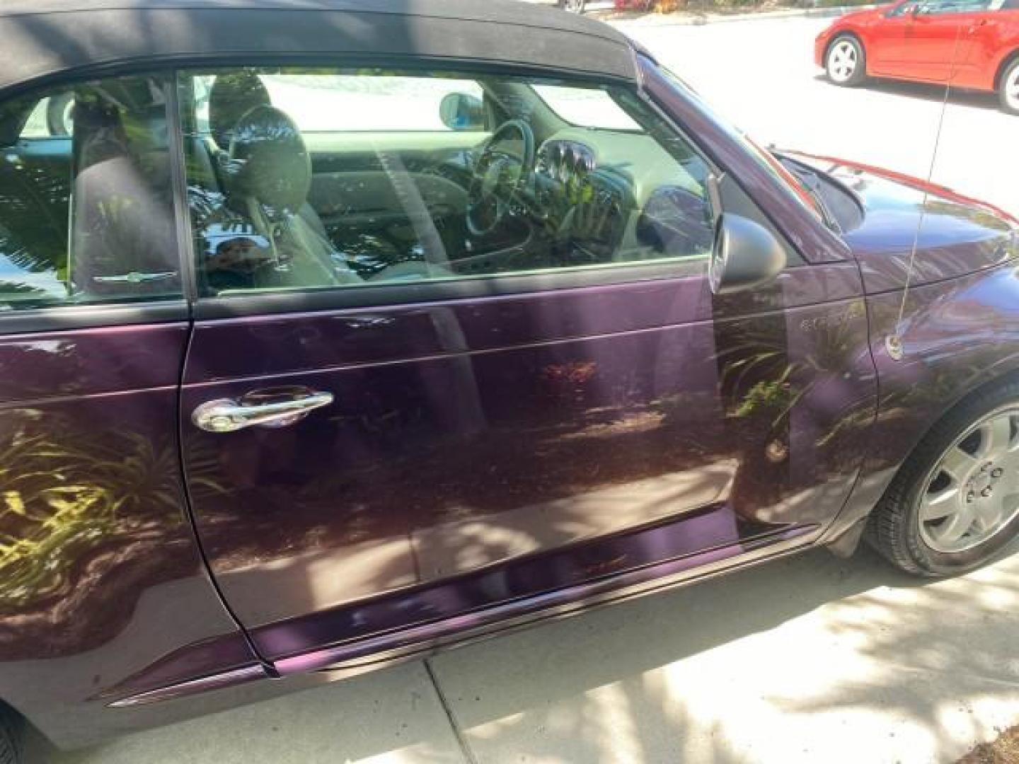 2005 Dark Plum Pearl /Taupe/Pearl Beige Chrysler PT Cruiser TURBO CONV LOW MILES 28,028 (3C3AY55E65T) with an 2.4L DOHC 16-Valve Turbo I4 Engine engine, Automatic transmission, located at 4701 North Dixie Hwy, Pompano Beach, FL, 33064, (954) 422-2889, 26.240938, -80.123474 - OUR WEBPAGE FLORIDACARS1.COM HAS OVER 100 PHOTOS AND FREE CARFAX LINK 2005 CHRYSLER PT CRUISER TOURING LEATHER LOADED VERY NICE NONSMOKER VIN: 3C3AY55E65T518675 3 C 3 A Y 5 5 E 6 5 T 5 1 8 6 7 5 CONVERTIBLE 2.4L I4 F DOHC 16V GASOLINE FRONT WHEEL DRIVE Top Features Alloy Wheels Leather Seats Satelli - Photo#79