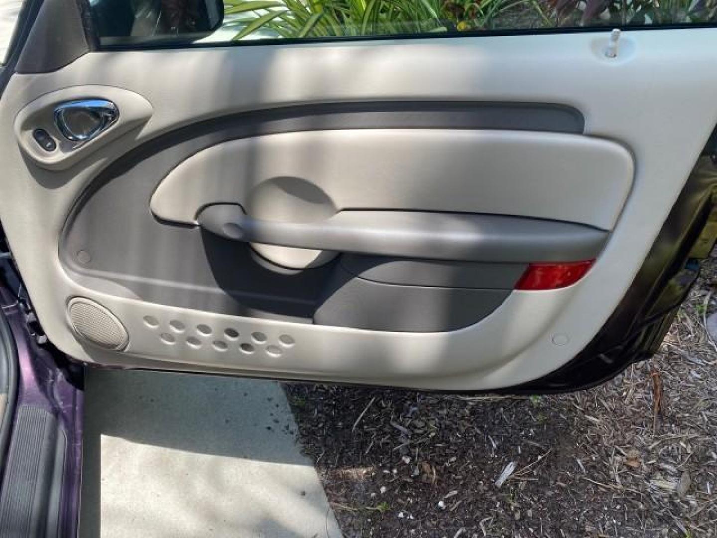 2005 Dark Plum Pearl /Taupe/Pearl Beige Chrysler PT Cruiser TURBO CONV LOW MILES 28,028 (3C3AY55E65T) with an 2.4L DOHC 16-Valve Turbo I4 Engine engine, Automatic transmission, located at 4701 North Dixie Hwy, Pompano Beach, FL, 33064, (954) 422-2889, 26.240938, -80.123474 - OUR WEBPAGE FLORIDACARS1.COM HAS OVER 100 PHOTOS AND FREE CARFAX LINK 2005 CHRYSLER PT CRUISER TOURING LEATHER LOADED VERY NICE NONSMOKER VIN: 3C3AY55E65T518675 3 C 3 A Y 5 5 E 6 5 T 5 1 8 6 7 5 CONVERTIBLE 2.4L I4 F DOHC 16V GASOLINE FRONT WHEEL DRIVE Top Features Alloy Wheels Leather Seats Satelli - Photo#81