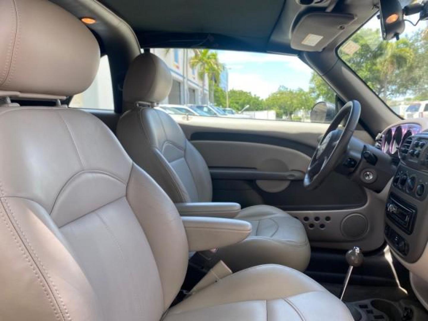 2005 Dark Plum Pearl /Taupe/Pearl Beige Chrysler PT Cruiser TURBO CONV LOW MILES 28,028 (3C3AY55E65T) with an 2.4L DOHC 16-Valve Turbo I4 Engine engine, Automatic transmission, located at 4701 North Dixie Hwy, Pompano Beach, FL, 33064, (954) 422-2889, 26.240938, -80.123474 - OUR WEBPAGE FLORIDACARS1.COM HAS OVER 100 PHOTOS AND FREE CARFAX LINK 2005 CHRYSLER PT CRUISER TOURING LEATHER LOADED VERY NICE NONSMOKER VIN: 3C3AY55E65T518675 3 C 3 A Y 5 5 E 6 5 T 5 1 8 6 7 5 CONVERTIBLE 2.4L I4 F DOHC 16V GASOLINE FRONT WHEEL DRIVE Top Features Alloy Wheels Leather Seats Satelli - Photo#83