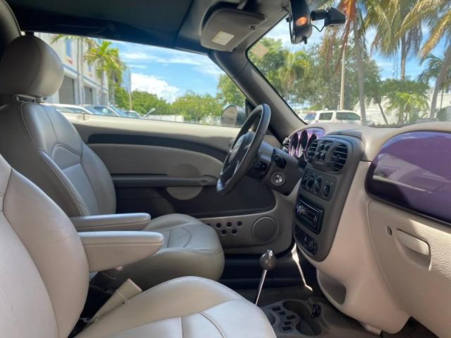 2005 Dark Plum Pearl /Taupe/Pearl Beige Chrysler PT Cruiser TURBO CONV LOW MILES 28,028 (3C3AY55E65T) with an 2.4L DOHC 16-Valve Turbo I4 Engine engine, Automatic transmission, located at 4701 North Dixie Hwy, Pompano Beach, FL, 33064, (954) 422-2889, 26.240938, -80.123474 - OUR WEBPAGE FLORIDACARS1.COM HAS OVER 100 PHOTOS AND FREE CARFAX LINK 2005 CHRYSLER PT CRUISER TOURING LEATHER LOADED VERY NICE NONSMOKER VIN: 3C3AY55E65T518675 3 C 3 A Y 5 5 E 6 5 T 5 1 8 6 7 5 CONVERTIBLE 2.4L I4 F DOHC 16V GASOLINE FRONT WHEEL DRIVE Top Features Alloy Wheels Leather Seats Satelli - Photo#85
