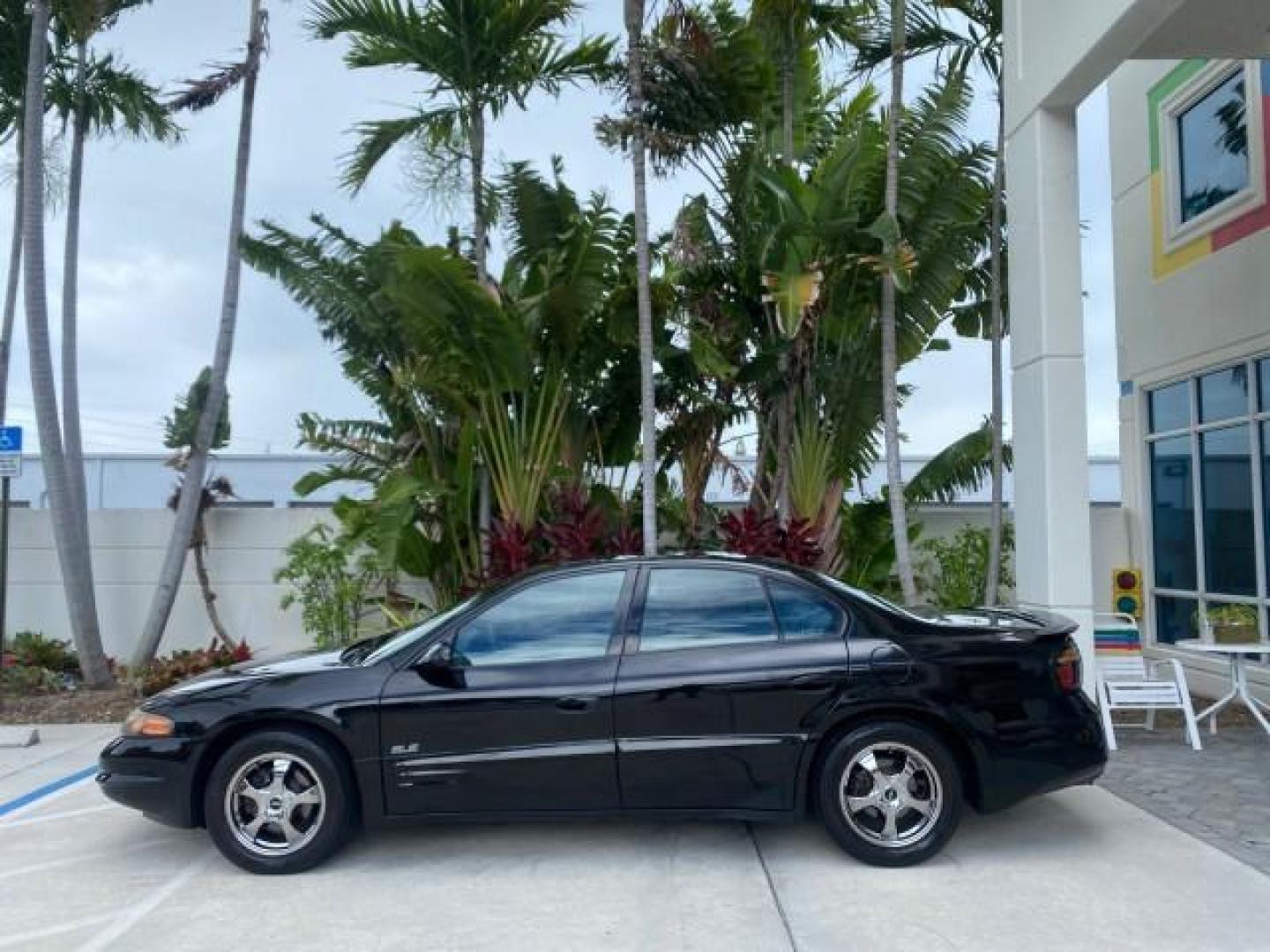 2002 Black /Dark Pewter Pontiac Bonneville SLE LOW MILES 82,619 (1G2HY54K224) with an 3.8L SFI V6 3800 Series II Engine engine, Automatic transmission, located at 4701 North Dixie Hwy, Pompano Beach, FL, 33064, (954) 422-2889, 26.240938, -80.123474 - OUR WEBPAGE FLORIDACARS1.COM HAS OVER 100 PHOTOS AND FREE CARFAX LINK 2002 PONTIAC BONNEVILLE SLE VIN: 1G2HY54K224170512 1 G 2 H Y 5 4 K 2 2 4 1 7 0 5 1 2 SEDAN 4 DR 3.8L V6 F GASOLINE FRONT WHEEL DRIVE Top Features Alloy Wheels Front Seat Heaters Leather Seats Sunroof(s) Basic Features ABS Brakes A - Photo#4