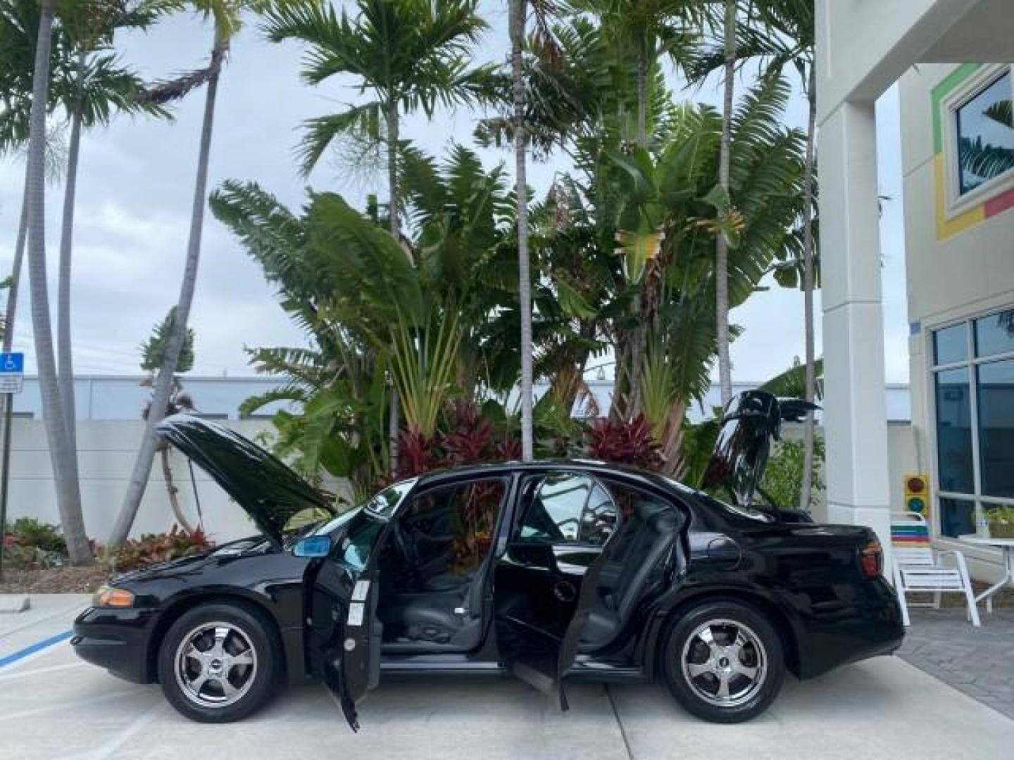 2002 Black /Dark Pewter Pontiac Bonneville SLE LOW MILES 82,619 (1G2HY54K224) with an 3.8L SFI V6 3800 Series II Engine engine, Automatic transmission, located at 4701 North Dixie Hwy, Pompano Beach, FL, 33064, (954) 422-2889, 26.240938, -80.123474 - OUR WEBPAGE FLORIDACARS1.COM HAS OVER 100 PHOTOS AND FREE CARFAX LINK 2002 PONTIAC BONNEVILLE SLE VIN: 1G2HY54K224170512 1 G 2 H Y 5 4 K 2 2 4 1 7 0 5 1 2 SEDAN 4 DR 3.8L V6 F GASOLINE FRONT WHEEL DRIVE Top Features Alloy Wheels Front Seat Heaters Leather Seats Sunroof(s) Basic Features ABS Brakes A - Photo#8