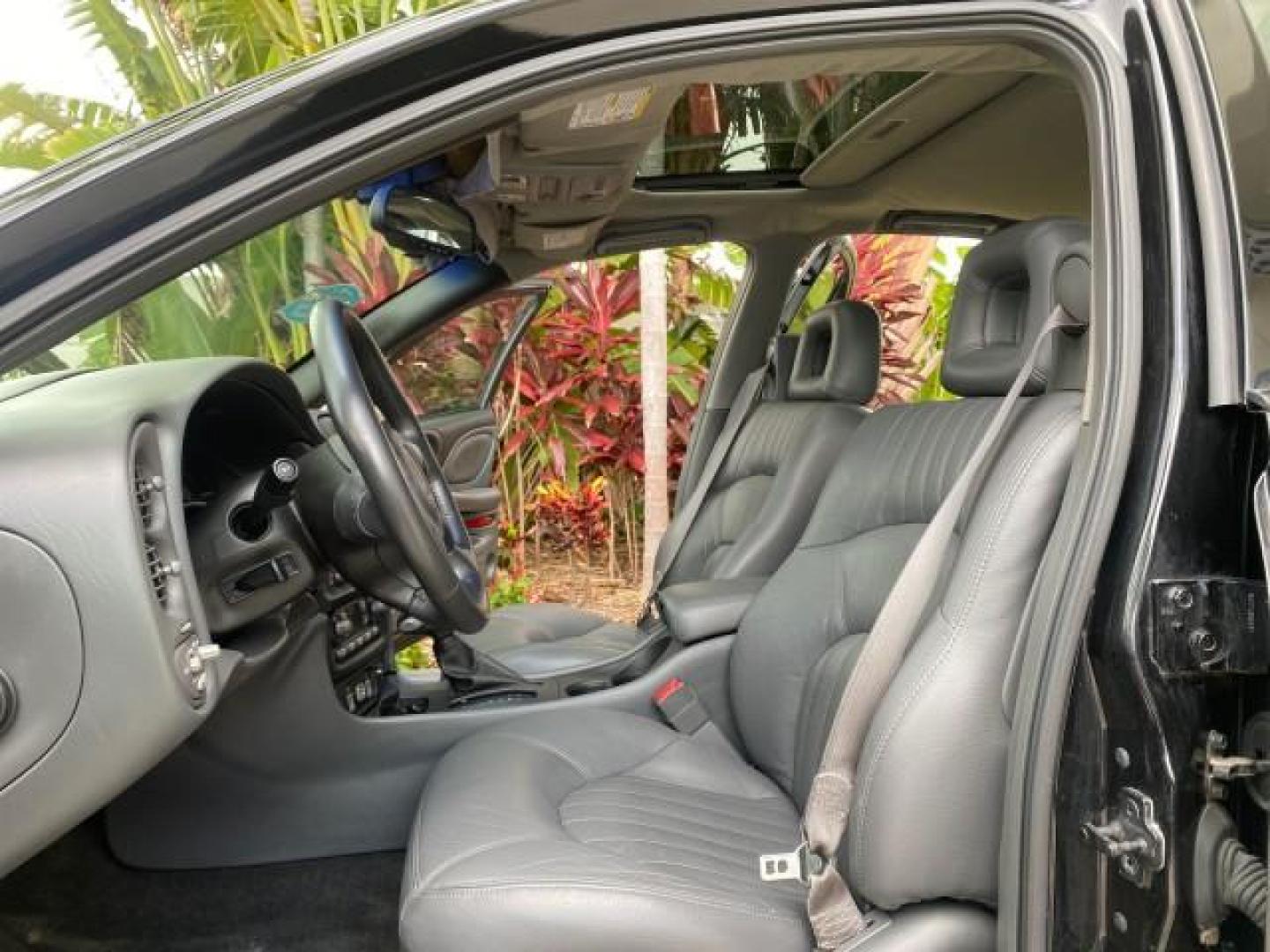2002 Black /Dark Pewter Pontiac Bonneville SLE LOW MILES 82,619 (1G2HY54K224) with an 3.8L SFI V6 3800 Series II Engine engine, Automatic transmission, located at 4701 North Dixie Hwy, Pompano Beach, FL, 33064, (954) 422-2889, 26.240938, -80.123474 - OUR WEBPAGE FLORIDACARS1.COM HAS OVER 100 PHOTOS AND FREE CARFAX LINK 2002 PONTIAC BONNEVILLE SLE VIN: 1G2HY54K224170512 1 G 2 H Y 5 4 K 2 2 4 1 7 0 5 1 2 SEDAN 4 DR 3.8L V6 F GASOLINE FRONT WHEEL DRIVE Top Features Alloy Wheels Front Seat Heaters Leather Seats Sunroof(s) Basic Features ABS Brakes A - Photo#10