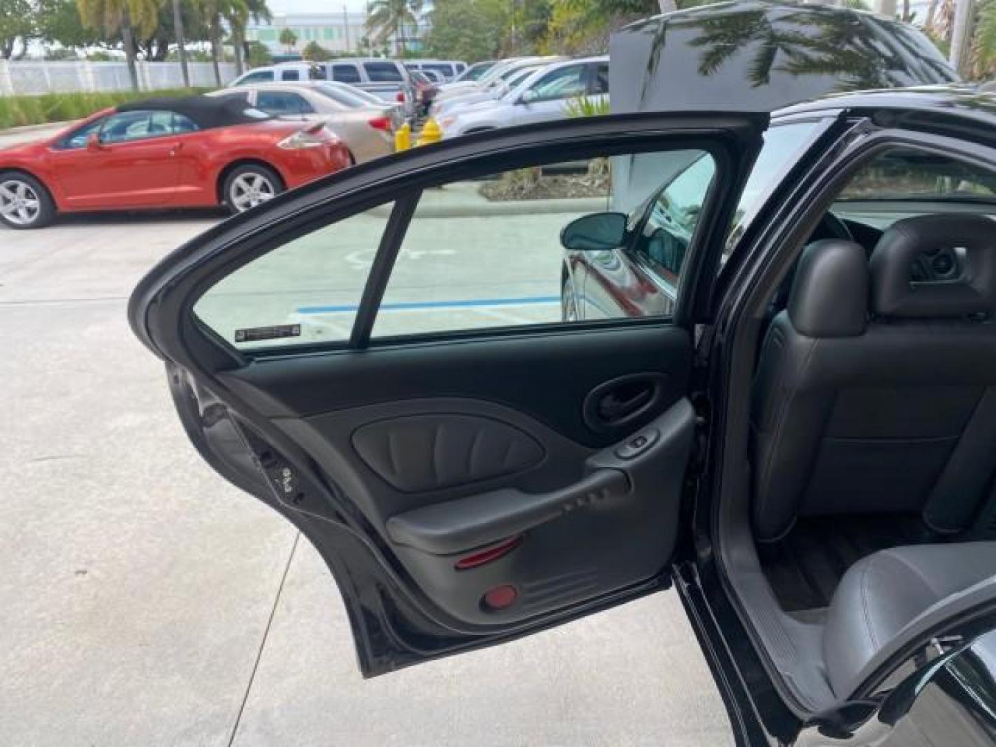 2002 Black /Dark Pewter Pontiac Bonneville SLE LOW MILES 82,619 (1G2HY54K224) with an 3.8L SFI V6 3800 Series II Engine engine, Automatic transmission, located at 4701 North Dixie Hwy, Pompano Beach, FL, 33064, (954) 422-2889, 26.240938, -80.123474 - OUR WEBPAGE FLORIDACARS1.COM HAS OVER 100 PHOTOS AND FREE CARFAX LINK 2002 PONTIAC BONNEVILLE SLE VIN: 1G2HY54K224170512 1 G 2 H Y 5 4 K 2 2 4 1 7 0 5 1 2 SEDAN 4 DR 3.8L V6 F GASOLINE FRONT WHEEL DRIVE Top Features Alloy Wheels Front Seat Heaters Leather Seats Sunroof(s) Basic Features ABS Brakes A - Photo#13