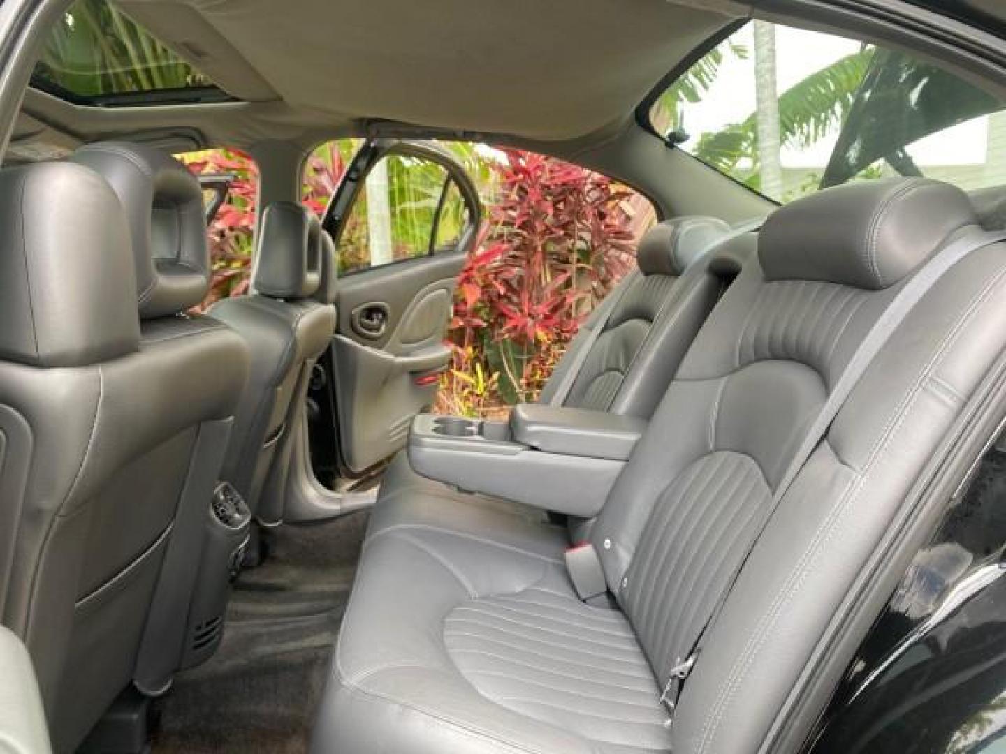 2002 Black /Dark Pewter Pontiac Bonneville SLE LOW MILES 82,619 (1G2HY54K224) with an 3.8L SFI V6 3800 Series II Engine engine, Automatic transmission, located at 4701 North Dixie Hwy, Pompano Beach, FL, 33064, (954) 422-2889, 26.240938, -80.123474 - OUR WEBPAGE FLORIDACARS1.COM HAS OVER 100 PHOTOS AND FREE CARFAX LINK 2002 PONTIAC BONNEVILLE SLE VIN: 1G2HY54K224170512 1 G 2 H Y 5 4 K 2 2 4 1 7 0 5 1 2 SEDAN 4 DR 3.8L V6 F GASOLINE FRONT WHEEL DRIVE Top Features Alloy Wheels Front Seat Heaters Leather Seats Sunroof(s) Basic Features ABS Brakes A - Photo#14