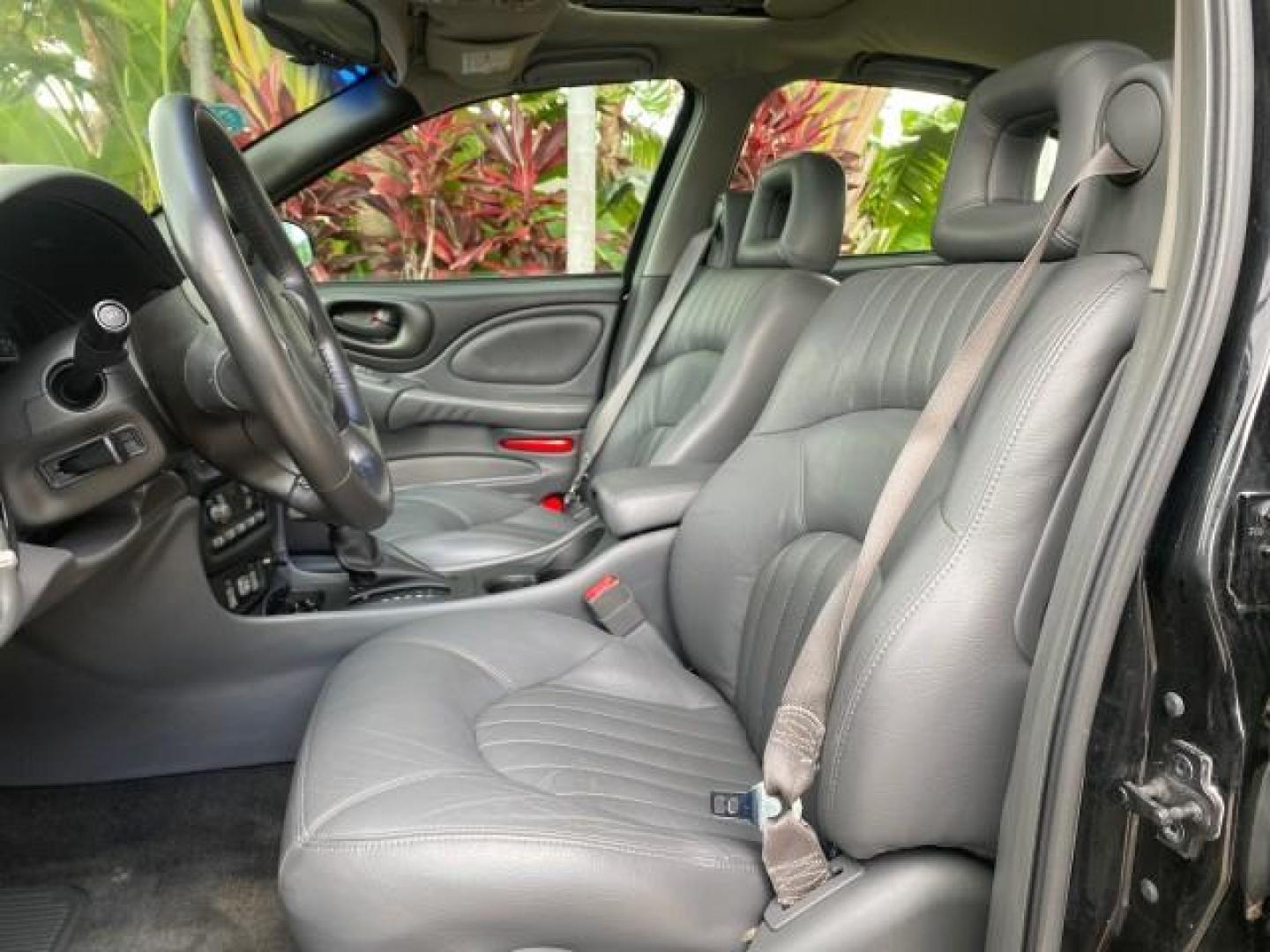 2002 Black /Dark Pewter Pontiac Bonneville SLE LOW MILES 82,619 (1G2HY54K224) with an 3.8L SFI V6 3800 Series II Engine engine, Automatic transmission, located at 4701 North Dixie Hwy, Pompano Beach, FL, 33064, (954) 422-2889, 26.240938, -80.123474 - OUR WEBPAGE FLORIDACARS1.COM HAS OVER 100 PHOTOS AND FREE CARFAX LINK 2002 PONTIAC BONNEVILLE SLE VIN: 1G2HY54K224170512 1 G 2 H Y 5 4 K 2 2 4 1 7 0 5 1 2 SEDAN 4 DR 3.8L V6 F GASOLINE FRONT WHEEL DRIVE Top Features Alloy Wheels Front Seat Heaters Leather Seats Sunroof(s) Basic Features ABS Brakes A - Photo#30