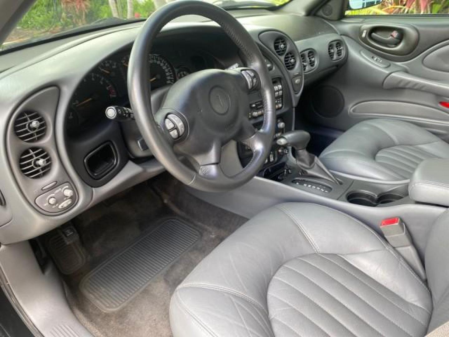 2002 Black /Dark Pewter Pontiac Bonneville SLE LOW MILES 82,619 (1G2HY54K224) with an 3.8L SFI V6 3800 Series II Engine engine, Automatic transmission, located at 4701 North Dixie Hwy, Pompano Beach, FL, 33064, (954) 422-2889, 26.240938, -80.123474 - OUR WEBPAGE FLORIDACARS1.COM HAS OVER 100 PHOTOS AND FREE CARFAX LINK 2002 PONTIAC BONNEVILLE SLE VIN: 1G2HY54K224170512 1 G 2 H Y 5 4 K 2 2 4 1 7 0 5 1 2 SEDAN 4 DR 3.8L V6 F GASOLINE FRONT WHEEL DRIVE Top Features Alloy Wheels Front Seat Heaters Leather Seats Sunroof(s) Basic Features ABS Brakes A - Photo#34