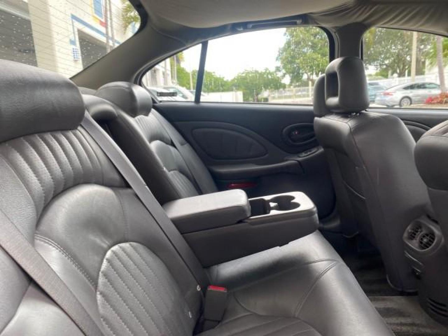 2002 Black /Dark Pewter Pontiac Bonneville SLE LOW MILES 82,619 (1G2HY54K224) with an 3.8L SFI V6 3800 Series II Engine engine, Automatic transmission, located at 4701 North Dixie Hwy, Pompano Beach, FL, 33064, (954) 422-2889, 26.240938, -80.123474 - OUR WEBPAGE FLORIDACARS1.COM HAS OVER 100 PHOTOS AND FREE CARFAX LINK 2002 PONTIAC BONNEVILLE SLE VIN: 1G2HY54K224170512 1 G 2 H Y 5 4 K 2 2 4 1 7 0 5 1 2 SEDAN 4 DR 3.8L V6 F GASOLINE FRONT WHEEL DRIVE Top Features Alloy Wheels Front Seat Heaters Leather Seats Sunroof(s) Basic Features ABS Brakes A - Photo#91