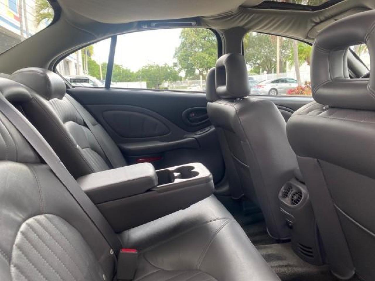 2002 Black /Dark Pewter Pontiac Bonneville SLE LOW MILES 82,619 (1G2HY54K224) with an 3.8L SFI V6 3800 Series II Engine engine, Automatic transmission, located at 4701 North Dixie Hwy, Pompano Beach, FL, 33064, (954) 422-2889, 26.240938, -80.123474 - OUR WEBPAGE FLORIDACARS1.COM HAS OVER 100 PHOTOS AND FREE CARFAX LINK 2002 PONTIAC BONNEVILLE SLE VIN: 1G2HY54K224170512 1 G 2 H Y 5 4 K 2 2 4 1 7 0 5 1 2 SEDAN 4 DR 3.8L V6 F GASOLINE FRONT WHEEL DRIVE Top Features Alloy Wheels Front Seat Heaters Leather Seats Sunroof(s) Basic Features ABS Brakes A - Photo#92