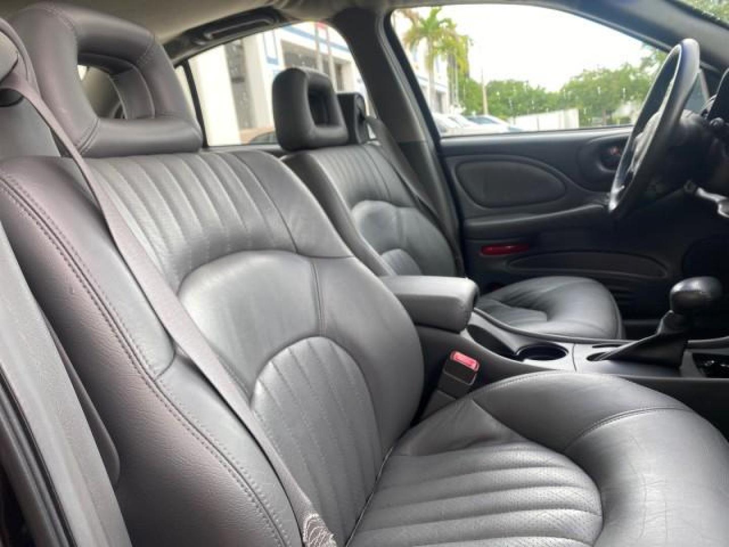 2002 Black /Dark Pewter Pontiac Bonneville SLE LOW MILES 82,619 (1G2HY54K224) with an 3.8L SFI V6 3800 Series II Engine engine, Automatic transmission, located at 4701 North Dixie Hwy, Pompano Beach, FL, 33064, (954) 422-2889, 26.240938, -80.123474 - OUR WEBPAGE FLORIDACARS1.COM HAS OVER 100 PHOTOS AND FREE CARFAX LINK 2002 PONTIAC BONNEVILLE SLE VIN: 1G2HY54K224170512 1 G 2 H Y 5 4 K 2 2 4 1 7 0 5 1 2 SEDAN 4 DR 3.8L V6 F GASOLINE FRONT WHEEL DRIVE Top Features Alloy Wheels Front Seat Heaters Leather Seats Sunroof(s) Basic Features ABS Brakes A - Photo#99