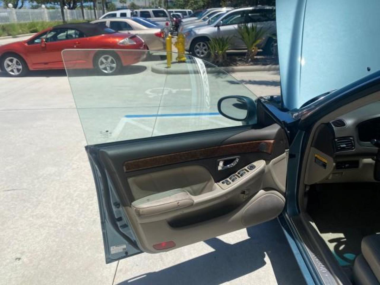 2005 Celadon Green /Beige Hyundai XG350 LOW MILES 46,921 1 OWNER (KMHFU45E55A) with an 3.5L DOHC MPI 24-Valve V6 Engine engine, Automatic transmission, located at 4701 North Dixie Hwy, Pompano Beach, FL, 33064, (954) 422-2889, 26.240938, -80.123474 - OUR WEBPAGE FLORIDACARS1.COM HAS OVER 100 PHOTOS AND FREE CARFAX LINK 2005 HYUNDAI XG350 VIN: KMHFU45E55A380931 K M H F U 4 5 E 5 5 A 3 8 0 9 3 1 SEDAN 4 DR 3.5L V6 F DOHC 24V GASOLINE FRONT WHEEL DRIVE Top Features Alloy Wheels Leather Seats Basic Features ABS Brakes AM/FM Stereo Air Conditioning A - Photo#9