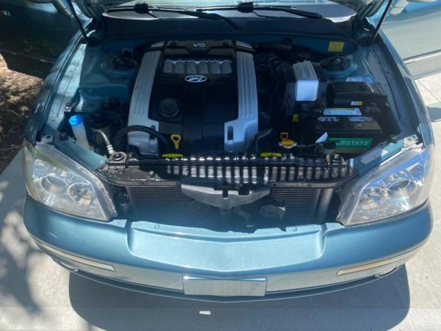 2005 Celadon Green /Beige Hyundai XG350 LOW MILES 46,921 1 OWNER (KMHFU45E55A) with an 3.5L DOHC MPI 24-Valve V6 Engine engine, Automatic transmission, located at 4701 North Dixie Hwy, Pompano Beach, FL, 33064, (954) 422-2889, 26.240938, -80.123474 - OUR WEBPAGE FLORIDACARS1.COM HAS OVER 100 PHOTOS AND FREE CARFAX LINK 2005 HYUNDAI XG350 VIN: KMHFU45E55A380931 K M H F U 4 5 E 5 5 A 3 8 0 9 3 1 SEDAN 4 DR 3.5L V6 F DOHC 24V GASOLINE FRONT WHEEL DRIVE Top Features Alloy Wheels Leather Seats Basic Features ABS Brakes AM/FM Stereo Air Conditioning A - Photo#17