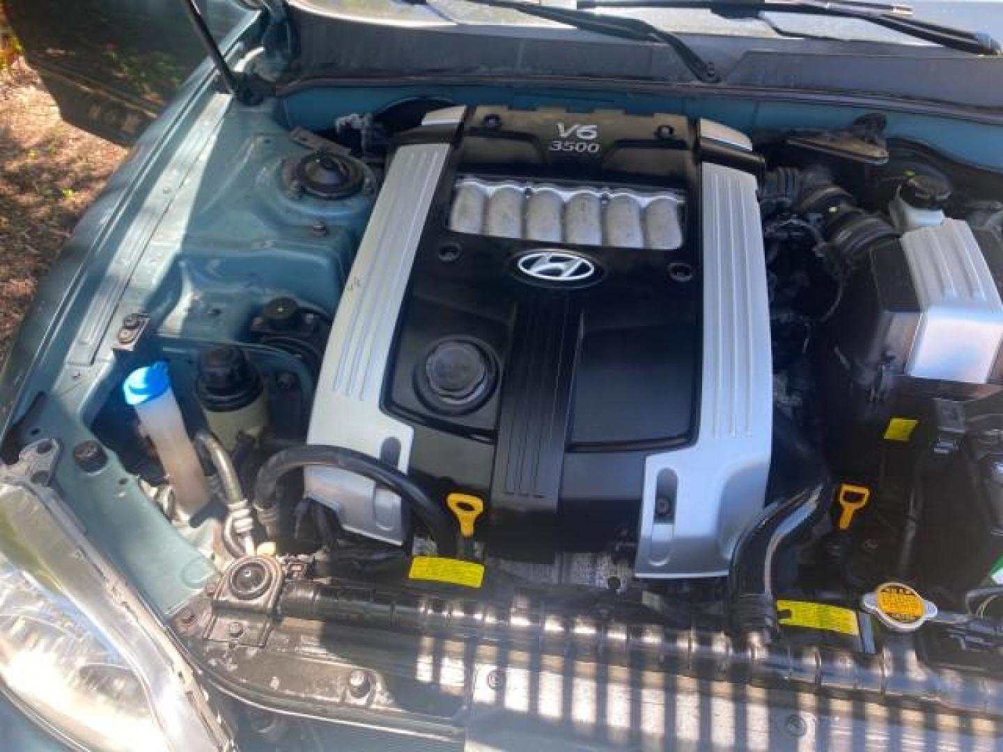 2005 Celadon Green /Beige Hyundai XG350 LOW MILES 46,921 1 OWNER (KMHFU45E55A) with an 3.5L DOHC MPI 24-Valve V6 Engine engine, Automatic transmission, located at 4701 North Dixie Hwy, Pompano Beach, FL, 33064, (954) 422-2889, 26.240938, -80.123474 - OUR WEBPAGE FLORIDACARS1.COM HAS OVER 100 PHOTOS AND FREE CARFAX LINK 2005 HYUNDAI XG350 VIN: KMHFU45E55A380931 K M H F U 4 5 E 5 5 A 3 8 0 9 3 1 SEDAN 4 DR 3.5L V6 F DOHC 24V GASOLINE FRONT WHEEL DRIVE Top Features Alloy Wheels Leather Seats Basic Features ABS Brakes AM/FM Stereo Air Conditioning A - Photo#25
