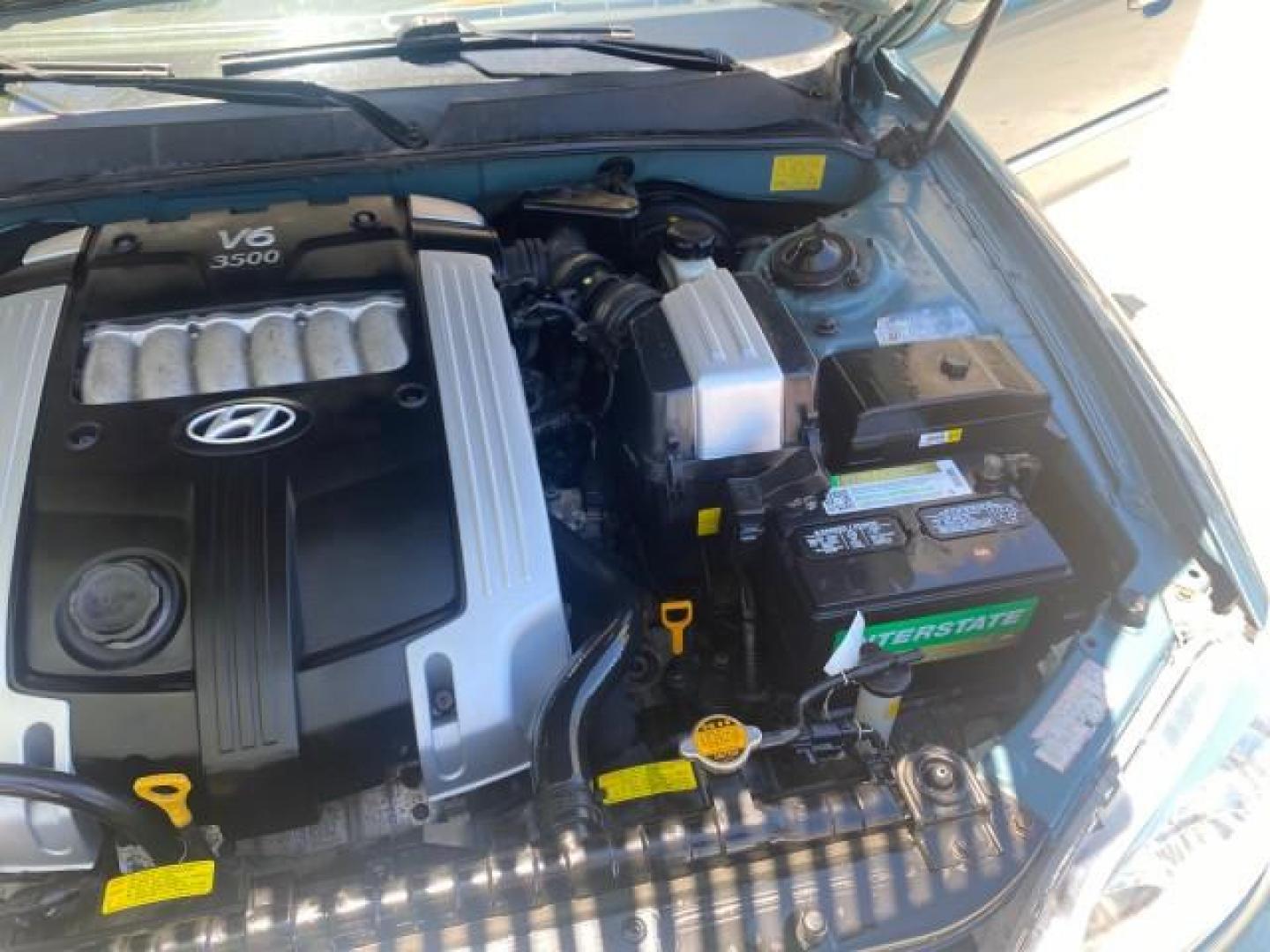 2005 Celadon Green /Beige Hyundai XG350 LOW MILES 46,921 1 OWNER (KMHFU45E55A) with an 3.5L DOHC MPI 24-Valve V6 Engine engine, Automatic transmission, located at 4701 North Dixie Hwy, Pompano Beach, FL, 33064, (954) 422-2889, 26.240938, -80.123474 - OUR WEBPAGE FLORIDACARS1.COM HAS OVER 100 PHOTOS AND FREE CARFAX LINK 2005 HYUNDAI XG350 VIN: KMHFU45E55A380931 K M H F U 4 5 E 5 5 A 3 8 0 9 3 1 SEDAN 4 DR 3.5L V6 F DOHC 24V GASOLINE FRONT WHEEL DRIVE Top Features Alloy Wheels Leather Seats Basic Features ABS Brakes AM/FM Stereo Air Conditioning A - Photo#26