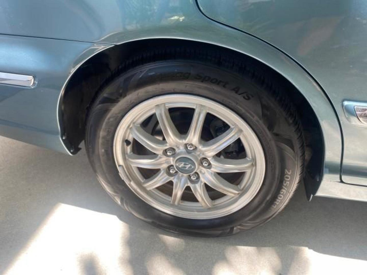 2005 Celadon Green /Beige Hyundai XG350 LOW MILES 46,921 1 OWNER (KMHFU45E55A) with an 3.5L DOHC MPI 24-Valve V6 Engine engine, Automatic transmission, located at 4701 North Dixie Hwy, Pompano Beach, FL, 33064, (954) 422-2889, 26.240938, -80.123474 - OUR WEBPAGE FLORIDACARS1.COM HAS OVER 100 PHOTOS AND FREE CARFAX LINK 2005 HYUNDAI XG350 VIN: KMHFU45E55A380931 K M H F U 4 5 E 5 5 A 3 8 0 9 3 1 SEDAN 4 DR 3.5L V6 F DOHC 24V GASOLINE FRONT WHEEL DRIVE Top Features Alloy Wheels Leather Seats Basic Features ABS Brakes AM/FM Stereo Air Conditioning A - Photo#89