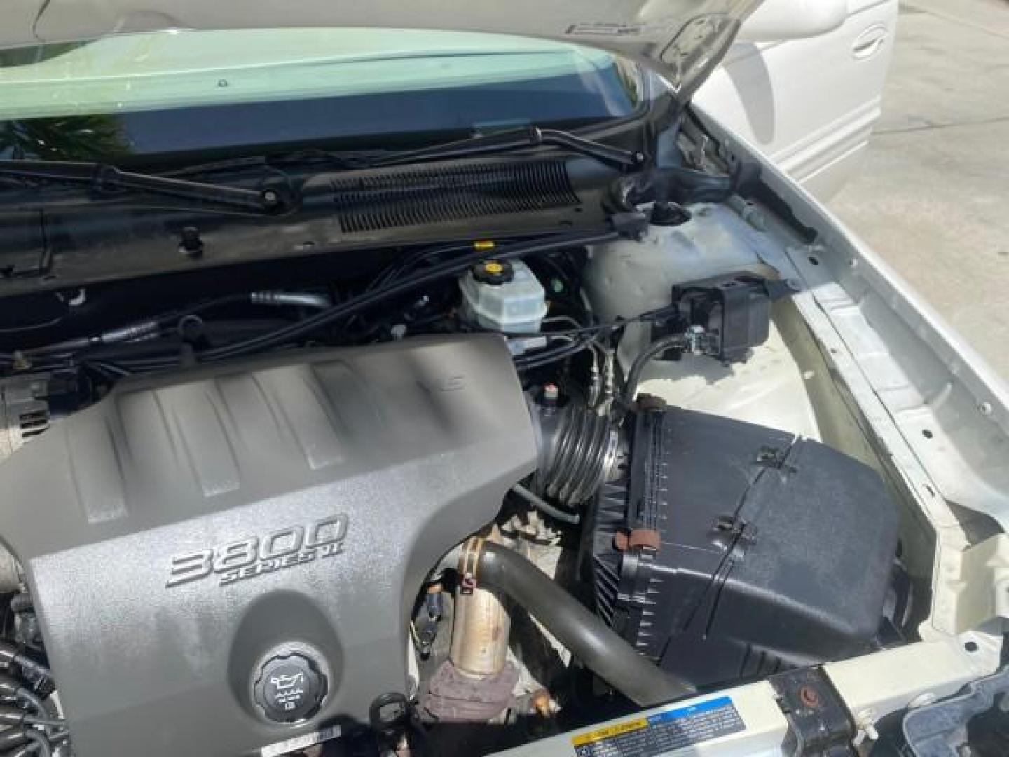 2003 White /Taupe Buick LeSabre Custom LOW MILES 32,880 1 OWNER (1G4HP54K63U) with an 3.8L 3800 V6 SFI Engine engine, Automatic transmission, located at 4701 North Dixie Hwy, Pompano Beach, FL, 33064, (954) 422-2889, 26.240938, -80.123474 - OUR WEBPAGE FLORIDACARS1.COM HAS OVER 100 PHOTOS AND FREE CARFAX LINK 2003 BUICK LESABRE CUSTOM VIN: 1G4HP54K63U139534 1 G 4 H P 5 4 K 6 3 U 1 3 9 5 3 4 SEDAN 4 DR 3.8L V6 F 12V 29 mpg GASOLINE FRONT WHEEL DRIVE Top Features Alloy Wheels Cloth Seats Leather Seats Luxury Package Basic Features ABS Br - Photo#26