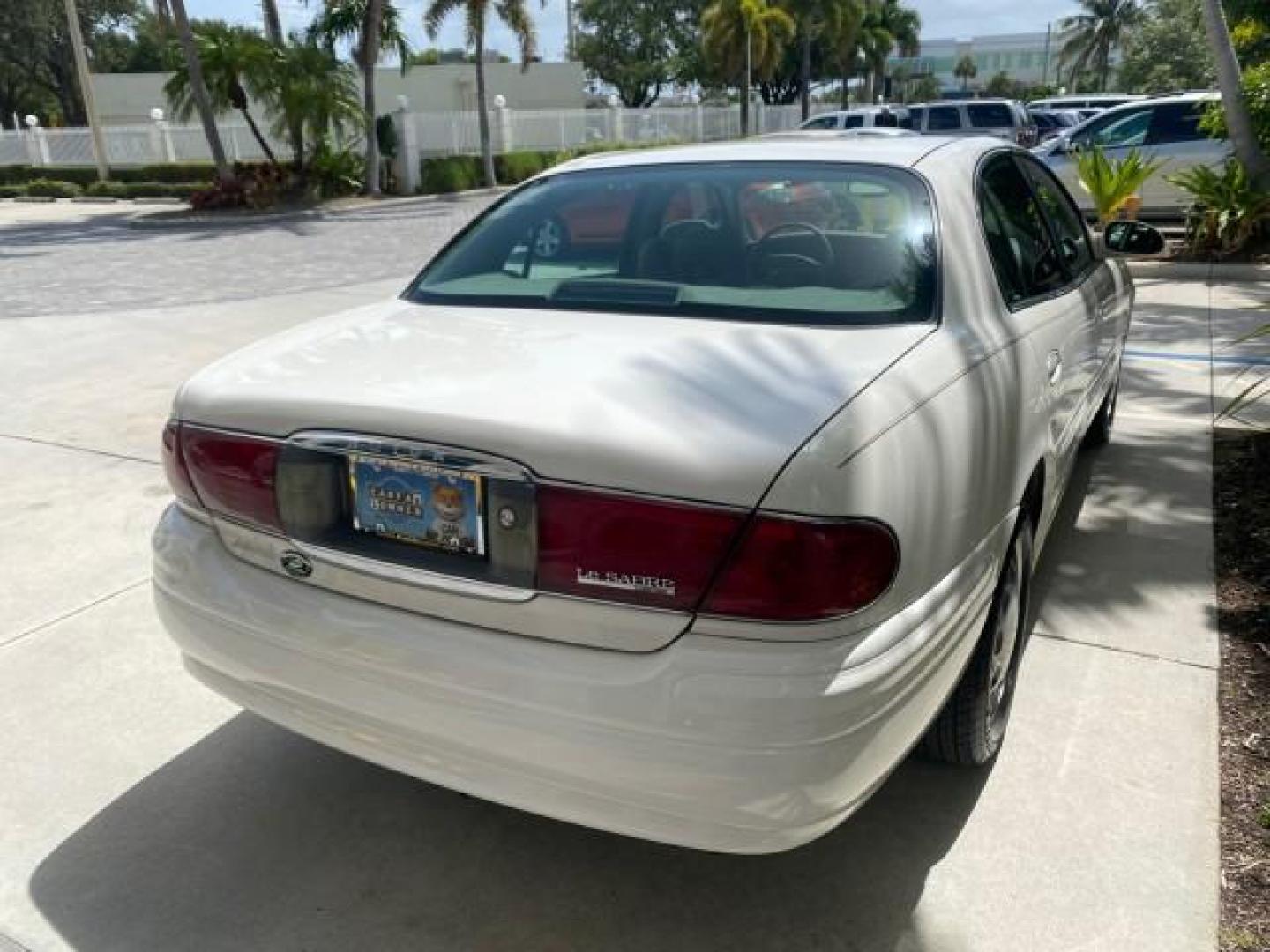 2003 White /Taupe Buick LeSabre Custom LOW MILES 32,880 1 OWNER (1G4HP54K63U) with an 3.8L 3800 V6 SFI Engine engine, Automatic transmission, located at 4701 North Dixie Hwy, Pompano Beach, FL, 33064, (954) 422-2889, 26.240938, -80.123474 - OUR WEBPAGE FLORIDACARS1.COM HAS OVER 100 PHOTOS AND FREE CARFAX LINK 2003 BUICK LESABRE CUSTOM VIN: 1G4HP54K63U139534 1 G 4 H P 5 4 K 6 3 U 1 3 9 5 3 4 SEDAN 4 DR 3.8L V6 F 12V 29 mpg GASOLINE FRONT WHEEL DRIVE Top Features Alloy Wheels Cloth Seats Leather Seats Luxury Package Basic Features ABS Br - Photo#75