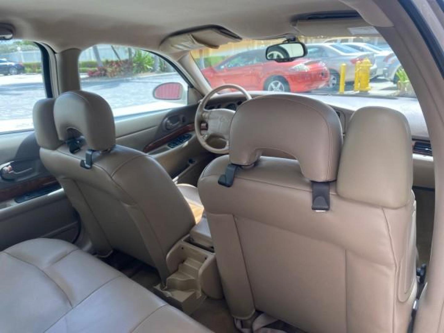 2003 White /Taupe Buick LeSabre Custom LOW MILES 32,880 1 OWNER (1G4HP54K63U) with an 3.8L 3800 V6 SFI Engine engine, Automatic transmission, located at 4701 North Dixie Hwy, Pompano Beach, FL, 33064, (954) 422-2889, 26.240938, -80.123474 - OUR WEBPAGE FLORIDACARS1.COM HAS OVER 100 PHOTOS AND FREE CARFAX LINK 2003 BUICK LESABRE CUSTOM VIN: 1G4HP54K63U139534 1 G 4 H P 5 4 K 6 3 U 1 3 9 5 3 4 SEDAN 4 DR 3.8L V6 F 12V 29 mpg GASOLINE FRONT WHEEL DRIVE Top Features Alloy Wheels Cloth Seats Leather Seats Luxury Package Basic Features ABS Br - Photo#90