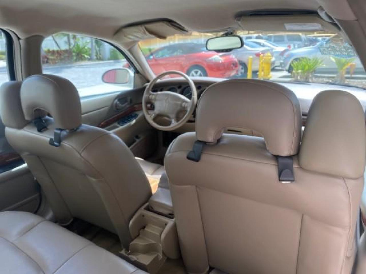 2003 White /Taupe Buick LeSabre Custom LOW MILES 32,880 1 OWNER (1G4HP54K63U) with an 3.8L 3800 V6 SFI Engine engine, Automatic transmission, located at 4701 North Dixie Hwy, Pompano Beach, FL, 33064, (954) 422-2889, 26.240938, -80.123474 - OUR WEBPAGE FLORIDACARS1.COM HAS OVER 100 PHOTOS AND FREE CARFAX LINK 2003 BUICK LESABRE CUSTOM VIN: 1G4HP54K63U139534 1 G 4 H P 5 4 K 6 3 U 1 3 9 5 3 4 SEDAN 4 DR 3.8L V6 F 12V 29 mpg GASOLINE FRONT WHEEL DRIVE Top Features Alloy Wheels Cloth Seats Leather Seats Luxury Package Basic Features ABS Br - Photo#91