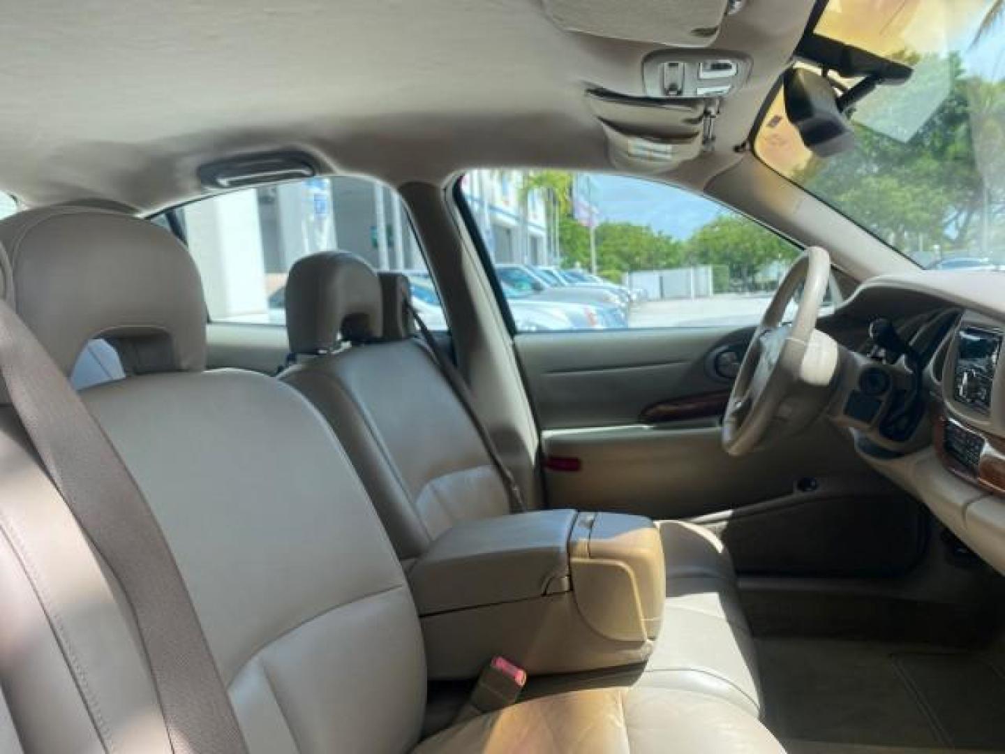 2003 White /Taupe Buick LeSabre Custom LOW MILES 32,880 1 OWNER (1G4HP54K63U) with an 3.8L 3800 V6 SFI Engine engine, Automatic transmission, located at 4701 North Dixie Hwy, Pompano Beach, FL, 33064, (954) 422-2889, 26.240938, -80.123474 - OUR WEBPAGE FLORIDACARS1.COM HAS OVER 100 PHOTOS AND FREE CARFAX LINK 2003 BUICK LESABRE CUSTOM VIN: 1G4HP54K63U139534 1 G 4 H P 5 4 K 6 3 U 1 3 9 5 3 4 SEDAN 4 DR 3.8L V6 F 12V 29 mpg GASOLINE FRONT WHEEL DRIVE Top Features Alloy Wheels Cloth Seats Leather Seats Luxury Package Basic Features ABS Br - Photo#96