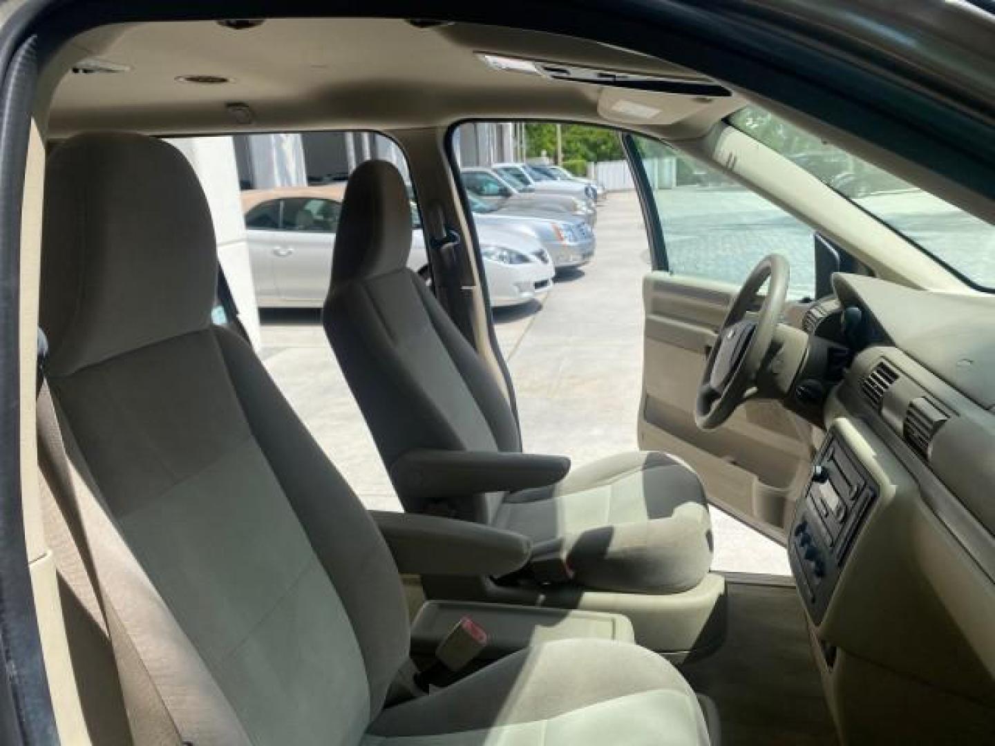 2006 Arizona Beige Metallic /Pebble Ford Freestar Wagon SE LOW MILES 57,712 (2FMZA51666B) with an 3.9L OHV V6 Engine engine, Automatic transmission, located at 4701 North Dixie Hwy, Pompano Beach, FL, 33064, (954) 422-2889, 26.240938, -80.123474 - OUR WEBPAGE FLORIDACARS1.COM HAS OVER 100 PHOTOS AND FREE CARFAX LINK 2006 FORD FREESTAR SE VIN: 2FMZA51666BA30658 2 F M Z A 5 1 6 6 6 B A 3 0 6 5 8 VAN 3.9L V6 F GASOLINE FRONT WHEEL DRIVE Top Features Cloth Seats Fold-Away Third Row Third Row Seat Basic Features ABS Brakes AM/FM Stereo Air Conditi - Photo#12