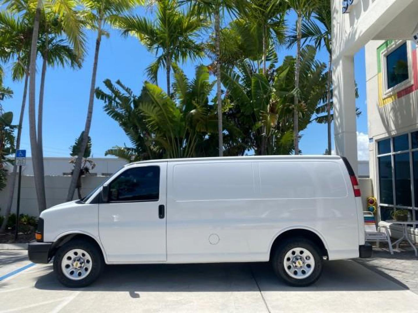 2013 Summit White /Medium Pewter Chevrolet Express Cargo Van LOW MILES 30,273 1 OWNER (1GCSGAFX7D1) with an 4.3L Vortec 1000 V6 MFI Engine engine, Automatic transmission, located at 4701 North Dixie Hwy, Pompano Beach, FL, 33064, (954) 422-2889, 26.240938, -80.123474 - OUR WEBPAGE FLORIDACARS1.COM HAS OVER 100 PHOTOS AND FREE CARFAX LINK 2013 CHEVROLET EXPRESS 1500 VIN: 1GCSGAFX7D1115905 1 G C S G A F X 7 D 1 1 1 5 9 0 5 VAN 4.3L V6 F OHV 12V GASOLINE REAR WHEEL DRIVE Top Features Rear Air Conditioning Vinyl Seats Basic Features ABS Brakes AM/FM Stereo Air Conditi - Photo#4