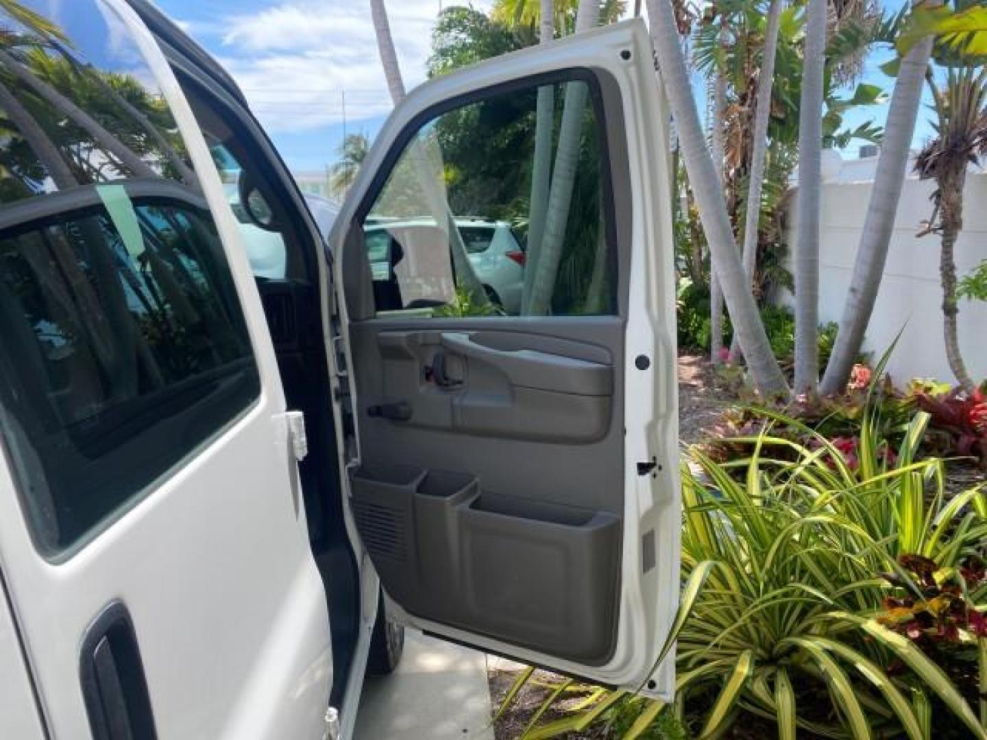 2013 Summit White /Medium Pewter Chevrolet Express Cargo Van LOW MILES 30,273 1 OWNER (1GCSGAFX7D1) with an 4.3L Vortec 1000 V6 MFI Engine engine, Automatic transmission, located at 4701 North Dixie Hwy, Pompano Beach, FL, 33064, (954) 422-2889, 26.240938, -80.123474 - OUR WEBPAGE FLORIDACARS1.COM HAS OVER 100 PHOTOS AND FREE CARFAX LINK 2013 CHEVROLET EXPRESS 1500 VIN: 1GCSGAFX7D1115905 1 G C S G A F X 7 D 1 1 1 5 9 0 5 VAN 4.3L V6 F OHV 12V GASOLINE REAR WHEEL DRIVE Top Features Rear Air Conditioning Vinyl Seats Basic Features ABS Brakes AM/FM Stereo Air Conditi - Photo#11