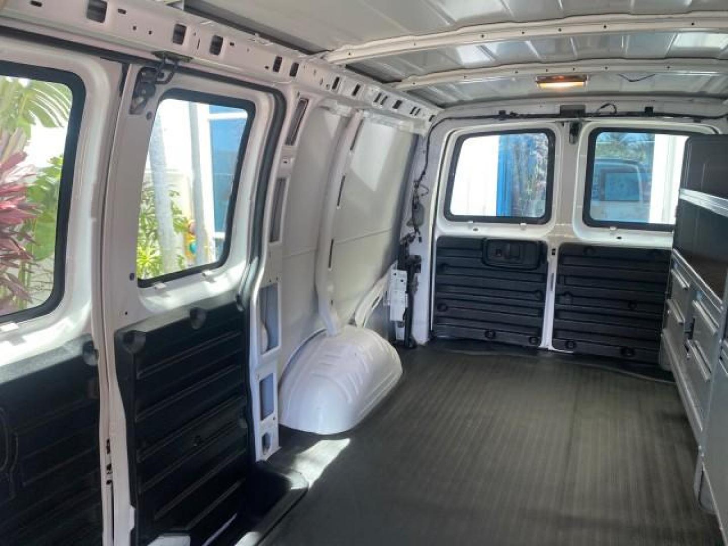 2013 Summit White /Medium Pewter Chevrolet Express Cargo Van LOW MILES 30,273 1 OWNER (1GCSGAFX7D1) with an 4.3L Vortec 1000 V6 MFI Engine engine, Automatic transmission, located at 4701 North Dixie Hwy, Pompano Beach, FL, 33064, (954) 422-2889, 26.240938, -80.123474 - OUR WEBPAGE FLORIDACARS1.COM HAS OVER 100 PHOTOS AND FREE CARFAX LINK 2013 CHEVROLET EXPRESS 1500 VIN: 1GCSGAFX7D1115905 1 G C S G A F X 7 D 1 1 1 5 9 0 5 VAN 4.3L V6 F OHV 12V GASOLINE REAR WHEEL DRIVE Top Features Rear Air Conditioning Vinyl Seats Basic Features ABS Brakes AM/FM Stereo Air Conditi - Photo#57