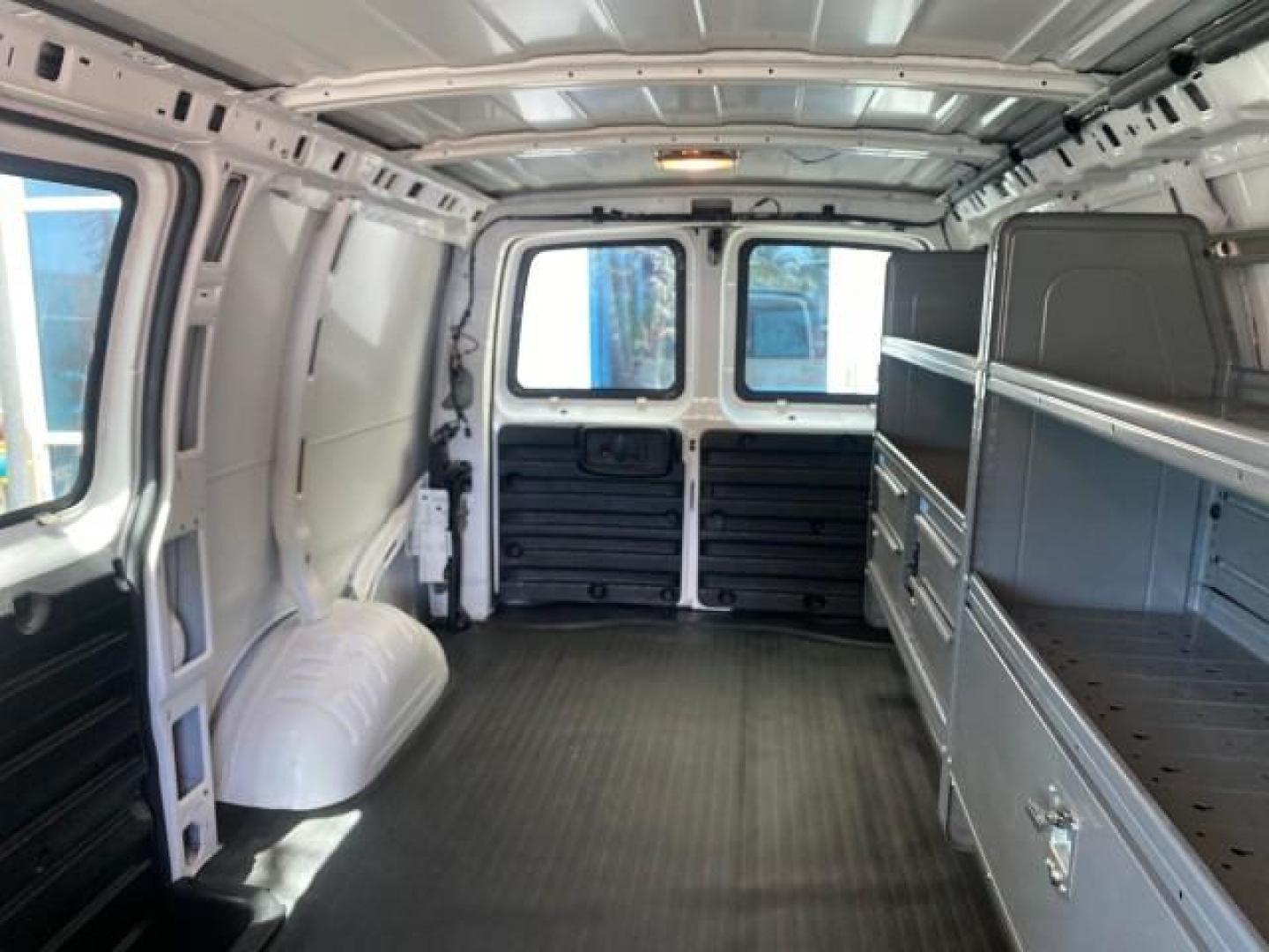 2013 Summit White /Medium Pewter Chevrolet Express Cargo Van LOW MILES 30,273 1 OWNER (1GCSGAFX7D1) with an 4.3L Vortec 1000 V6 MFI Engine engine, Automatic transmission, located at 4701 North Dixie Hwy, Pompano Beach, FL, 33064, (954) 422-2889, 26.240938, -80.123474 - OUR WEBPAGE FLORIDACARS1.COM HAS OVER 100 PHOTOS AND FREE CARFAX LINK 2013 CHEVROLET EXPRESS 1500 VIN: 1GCSGAFX7D1115905 1 G C S G A F X 7 D 1 1 1 5 9 0 5 VAN 4.3L V6 F OHV 12V GASOLINE REAR WHEEL DRIVE Top Features Rear Air Conditioning Vinyl Seats Basic Features ABS Brakes AM/FM Stereo Air Conditi - Photo#58