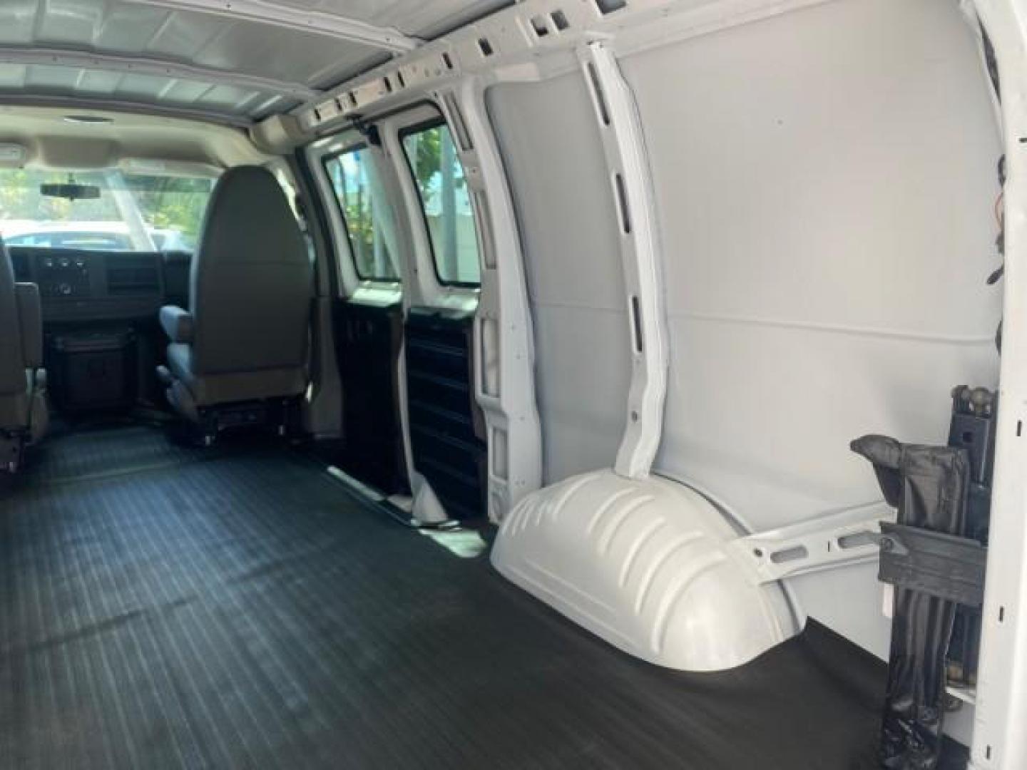 2013 Summit White /Medium Pewter Chevrolet Express Cargo Van LOW MILES 30,273 1 OWNER (1GCSGAFX7D1) with an 4.3L Vortec 1000 V6 MFI Engine engine, Automatic transmission, located at 4701 North Dixie Hwy, Pompano Beach, FL, 33064, (954) 422-2889, 26.240938, -80.123474 - OUR WEBPAGE FLORIDACARS1.COM HAS OVER 100 PHOTOS AND FREE CARFAX LINK 2013 CHEVROLET EXPRESS 1500 VIN: 1GCSGAFX7D1115905 1 G C S G A F X 7 D 1 1 1 5 9 0 5 VAN 4.3L V6 F OHV 12V GASOLINE REAR WHEEL DRIVE Top Features Rear Air Conditioning Vinyl Seats Basic Features ABS Brakes AM/FM Stereo Air Conditi - Photo#74