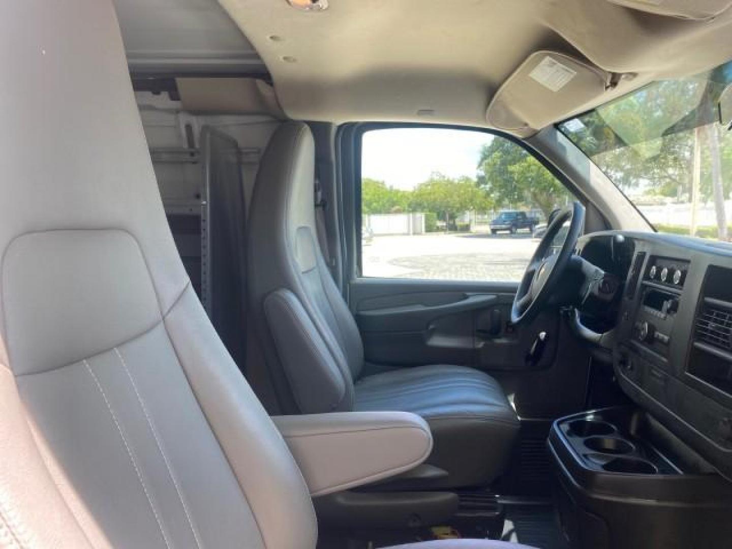 2013 Summit White /Medium Pewter Chevrolet Express Cargo Van LOW MILES 30,273 1 OWNER (1GCSGAFX7D1) with an 4.3L Vortec 1000 V6 MFI Engine engine, Automatic transmission, located at 4701 North Dixie Hwy, Pompano Beach, FL, 33064, (954) 422-2889, 26.240938, -80.123474 - OUR WEBPAGE FLORIDACARS1.COM HAS OVER 100 PHOTOS AND FREE CARFAX LINK 2013 CHEVROLET EXPRESS 1500 VIN: 1GCSGAFX7D1115905 1 G C S G A F X 7 D 1 1 1 5 9 0 5 VAN 4.3L V6 F OHV 12V GASOLINE REAR WHEEL DRIVE Top Features Rear Air Conditioning Vinyl Seats Basic Features ABS Brakes AM/FM Stereo Air Conditi - Photo#93