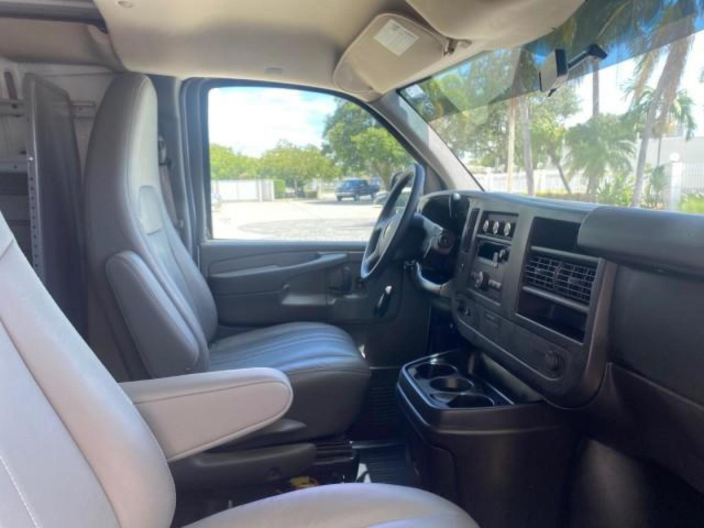 2013 Summit White /Medium Pewter Chevrolet Express Cargo Van LOW MILES 30,273 1 OWNER (1GCSGAFX7D1) with an 4.3L Vortec 1000 V6 MFI Engine engine, Automatic transmission, located at 4701 North Dixie Hwy, Pompano Beach, FL, 33064, (954) 422-2889, 26.240938, -80.123474 - OUR WEBPAGE FLORIDACARS1.COM HAS OVER 100 PHOTOS AND FREE CARFAX LINK 2013 CHEVROLET EXPRESS 1500 VIN: 1GCSGAFX7D1115905 1 G C S G A F X 7 D 1 1 1 5 9 0 5 VAN 4.3L V6 F OHV 12V GASOLINE REAR WHEEL DRIVE Top Features Rear Air Conditioning Vinyl Seats Basic Features ABS Brakes AM/FM Stereo Air Conditi - Photo#95