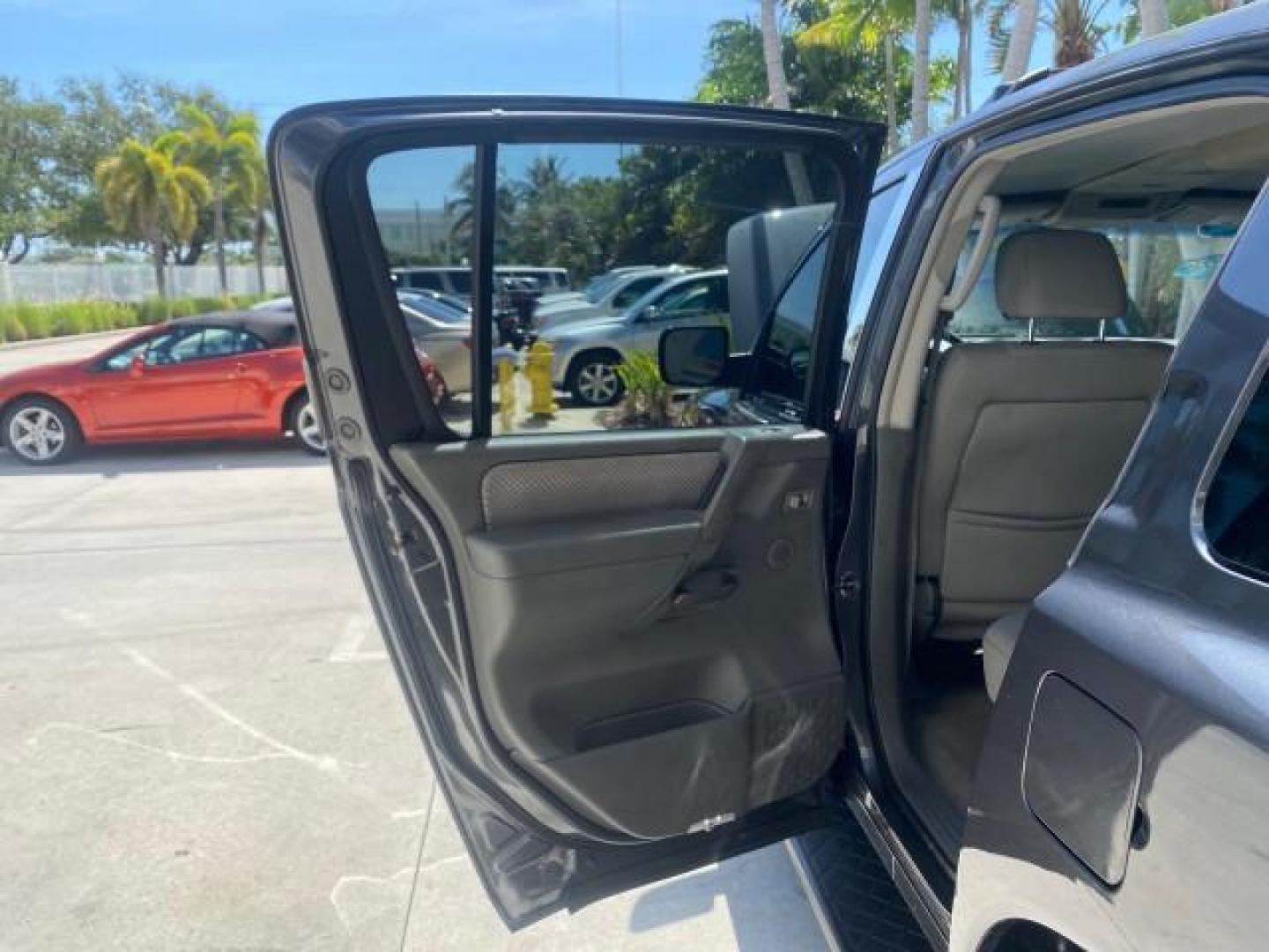 2006 Smoke Metallic /Graphite/Titanium Nissan Armada SE 21 SERVICES NO ACCIDENTS (5N1AA08A96N) with an 5.6L DOHC 32-Valve Endurance V8 Engine engine, Automatic transmission, located at 4701 North Dixie Hwy, Pompano Beach, FL, 33064, (954) 422-2889, 26.240938, -80.123474 - OUR WEBPAGE FLORIDACARS1.COM HAS OVER 100 PHOTOS AND FREE CARFAX LINK 2006 NISSAN ARMADA SE VIN: 5N1AA08A96N736506 5 N 1 A A 0 8 A 9 6 N 7 3 6 5 0 6 4 DOOR WAGON/SPORT UTILITY 5.6L V8 F DOHC 32V GASOLINE REAR WHEEL DRIVE Top Features Alloy Wheels Cloth Seats Fold-Away Third Row Parking Sensors Rear - Photo#13