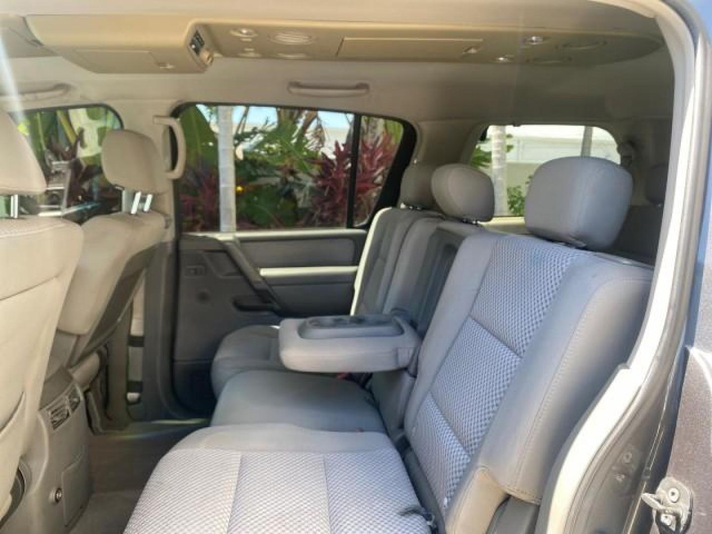 2006 Smoke Metallic /Graphite/Titanium Nissan Armada SE 21 SERVICES NO ACCIDENTS (5N1AA08A96N) with an 5.6L DOHC 32-Valve Endurance V8 Engine engine, Automatic transmission, located at 4701 North Dixie Hwy, Pompano Beach, FL, 33064, (954) 422-2889, 26.240938, -80.123474 - OUR WEBPAGE FLORIDACARS1.COM HAS OVER 100 PHOTOS AND FREE CARFAX LINK 2006 NISSAN ARMADA SE VIN: 5N1AA08A96N736506 5 N 1 A A 0 8 A 9 6 N 7 3 6 5 0 6 4 DOOR WAGON/SPORT UTILITY 5.6L V8 F DOHC 32V GASOLINE REAR WHEEL DRIVE Top Features Alloy Wheels Cloth Seats Fold-Away Third Row Parking Sensors Rear - Photo#64